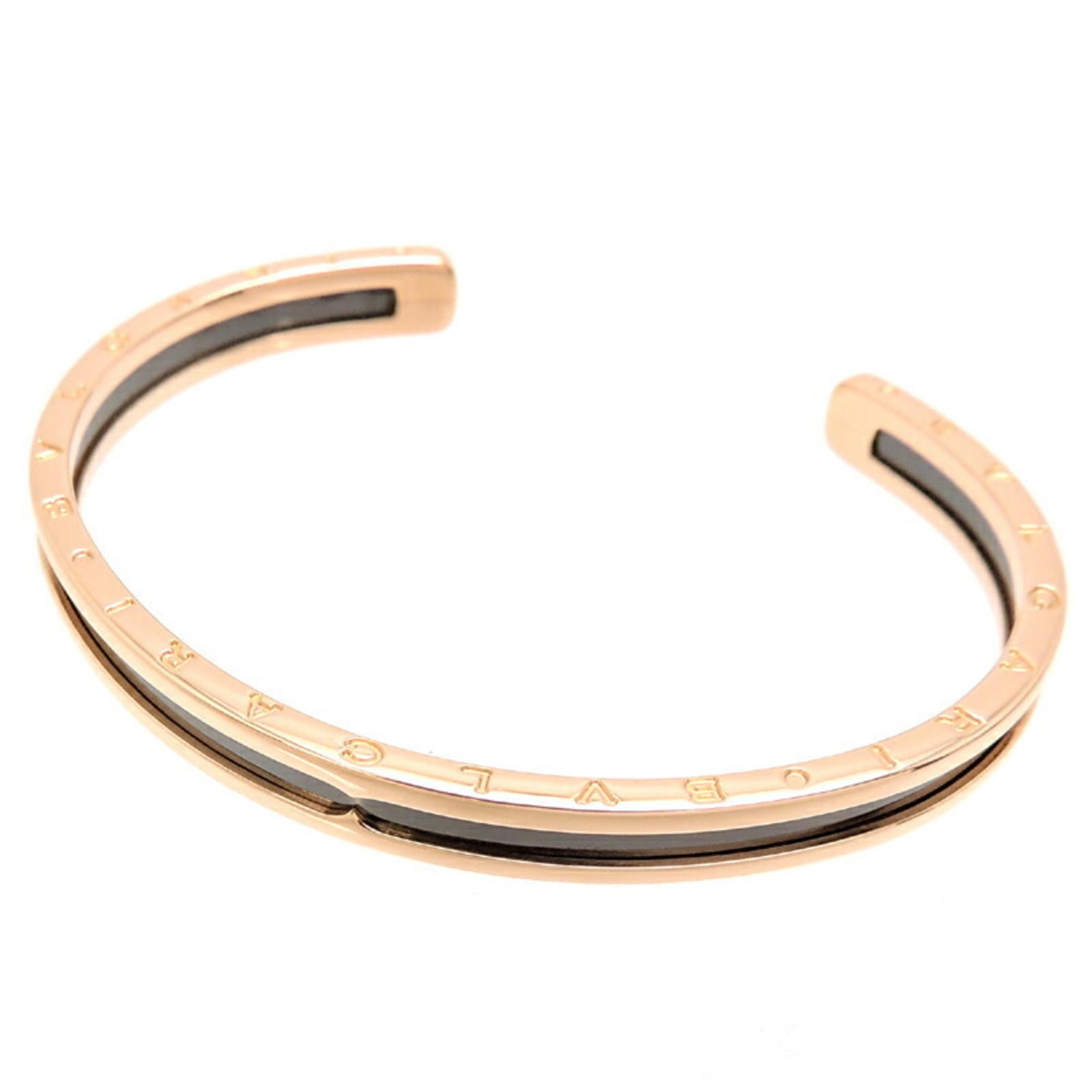 Bvlgari Bangle Pink Gold (18K) Stainless Steel: Bvlgari Bangle Pink Gold (18K) Stainless Steel Pink Gold (18K) Stainless Steel Bvlgari Bangle, 6mm width, 16cm length. This used Bvlgari bangle features pink gold (18K) and stainless steel constructio