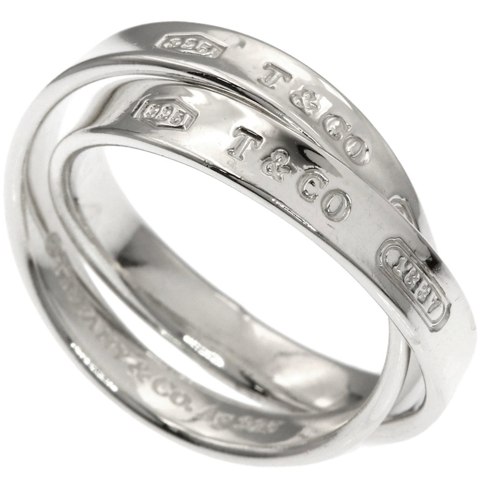 Silver Ring Tiffany Band: Silver Ring Tiffany Band Silver Ring Tiffany Band features a sleek band design made from silver, available in women's sizes. This used ring shows some signs of wear, including scratches and minor