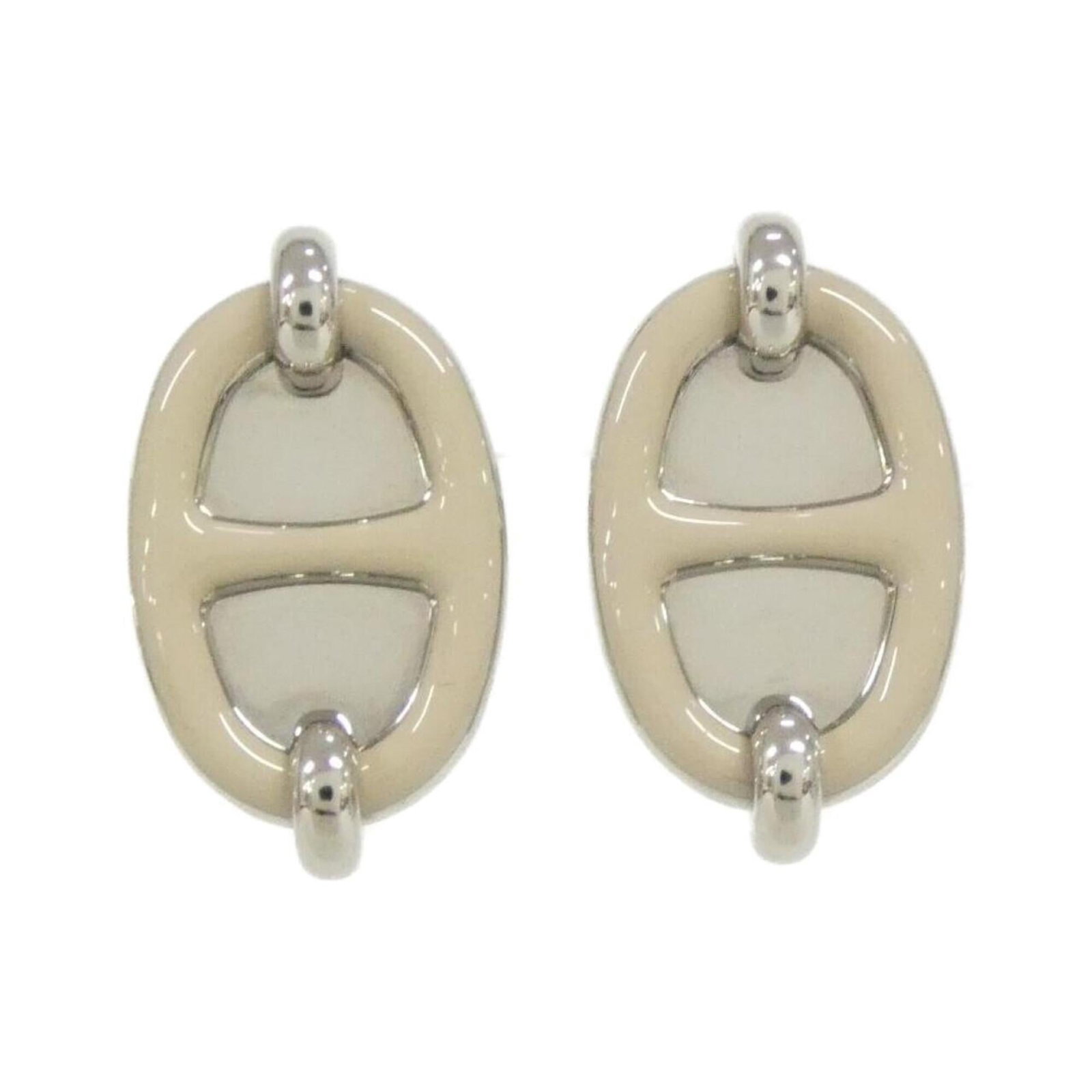 Hermes Stud Earrings: Hermes Stud Earrings Stud earrings from the renowned French luxury brand Hermes, featuring a classic design with subtle elegance. The beige and silver stud earrings have some minor signs of usage,