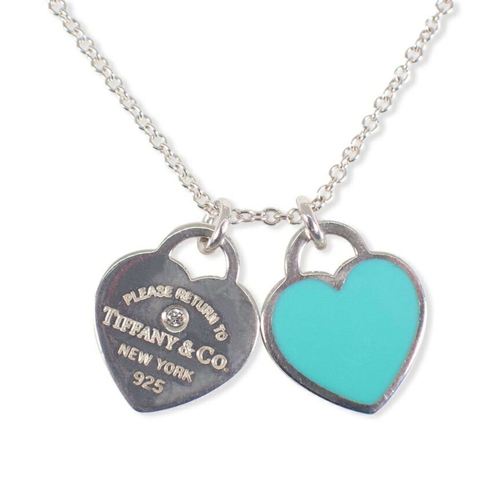 Return to Tiffany double heart tag pendant in blue enamel: Return to Tiffany double heart tag pendant in blue enamel Double heart tag pendant in blue enamel, crafted from sterling silver and enamel, adds a touch of elegance to any outfit. The necklace