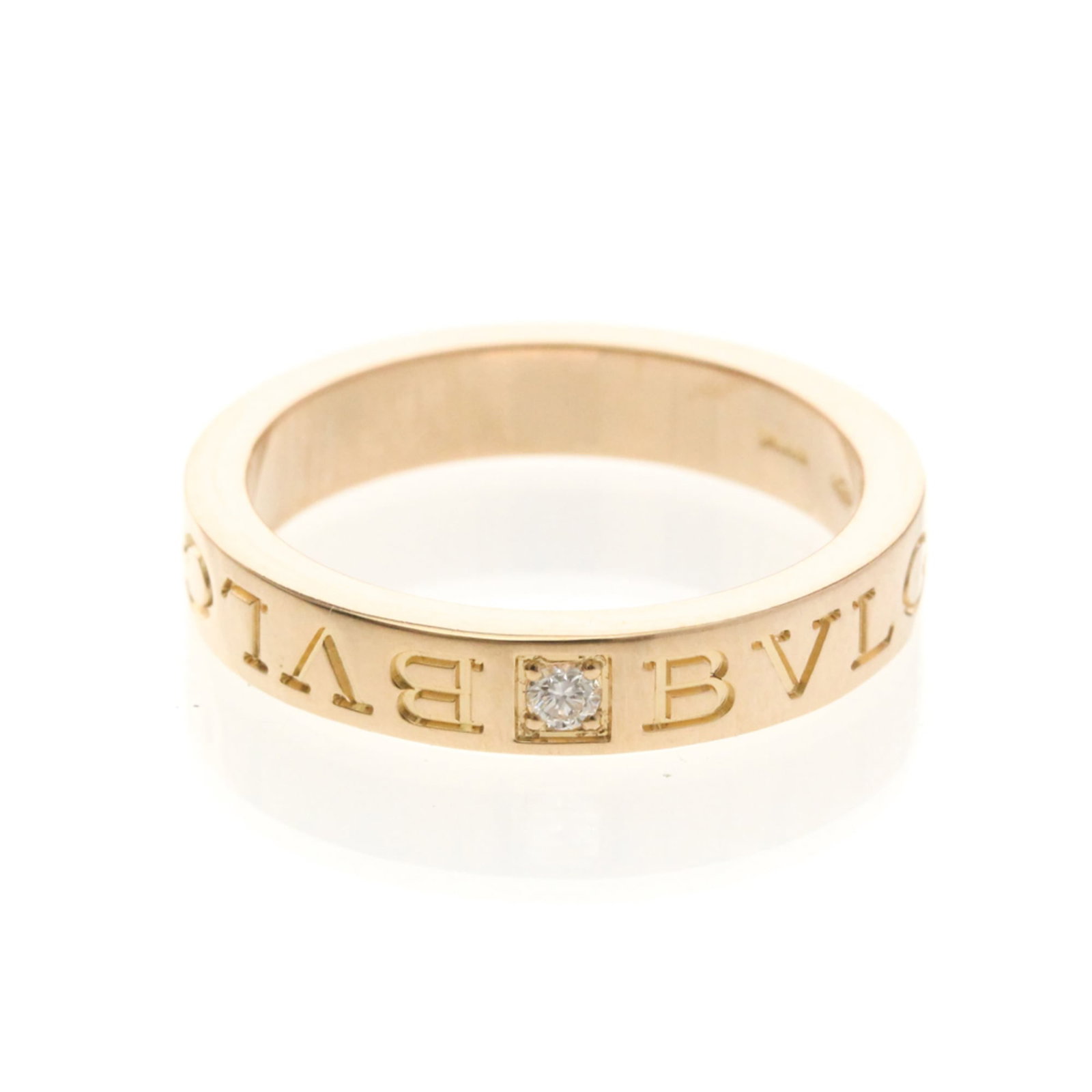 Pink Gold 18K Bvlgari Band Ring: Pink Gold 18K Bvlgari Band Ring Pink Gold 18K Bvlgari Band Ring features a striking pink gold design, adorned with diamonds. The 18K metal construction provides durability and luxury feel, while the