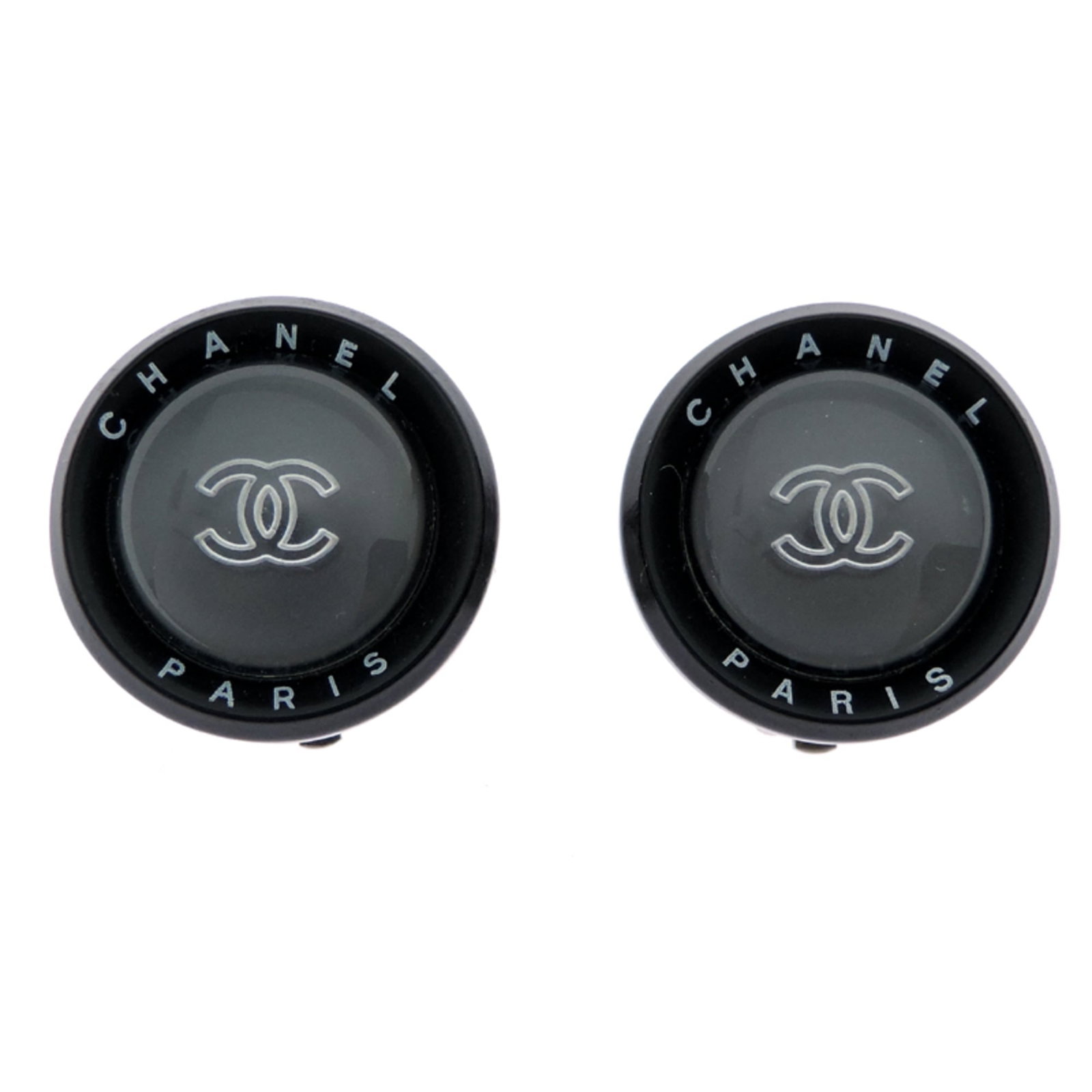 Metal clip earrings by Chanel: Metal clip earrings by Chanel Metal clip earrings by Chanel, featuring black and silver tones, are a sleek accessory for everyday wear. With their compact size and minimalist design, they add a touch 
