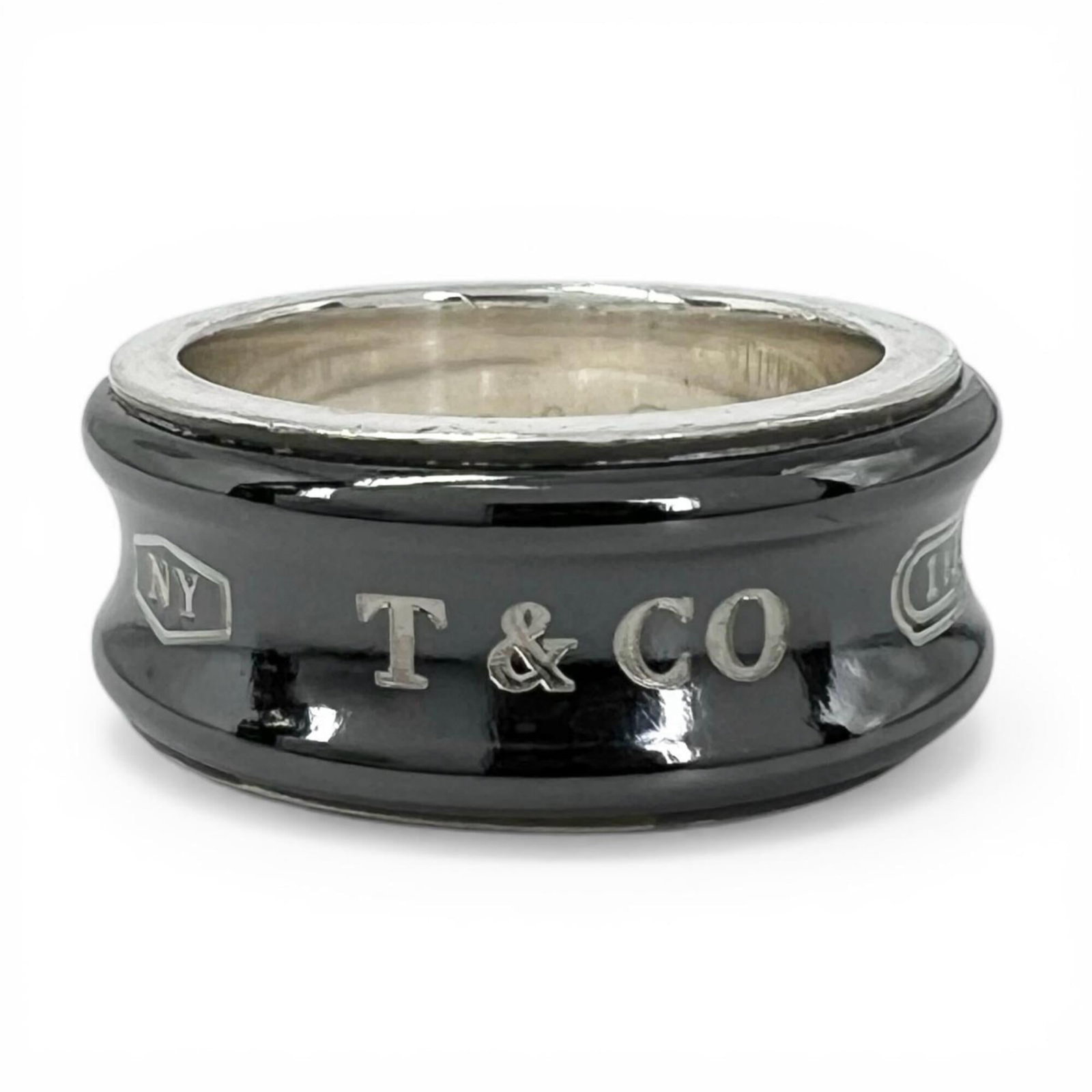 Tiffany Band Ring Silver 925 Titanium: Tiffany Band Ring Silver 925 Titanium Silver 925 and Titanium construction for durability, Black finish adds a touch of elegance. This Tiffany Type band ring features a classic design with a few trace