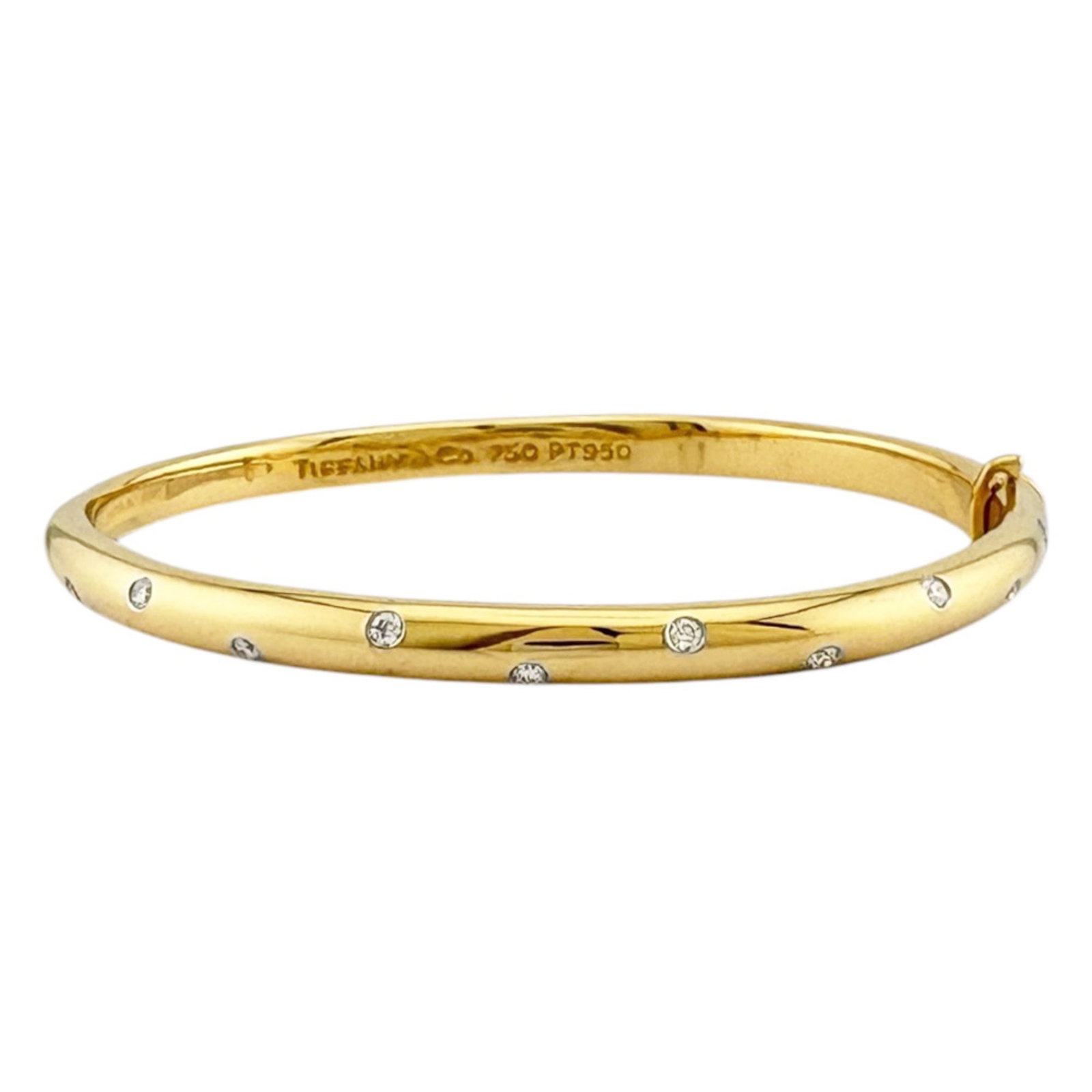 Platinum Yellow Gold Bangle 18K Tiffany: Platinum Yellow Gold Bangle 18K Tiffany Platinum Yellow Gold Bangle 18K Tiffany features an 18k platinum and yellow gold construction, with a subtle shine from the platinum accents. The bangle boasts 