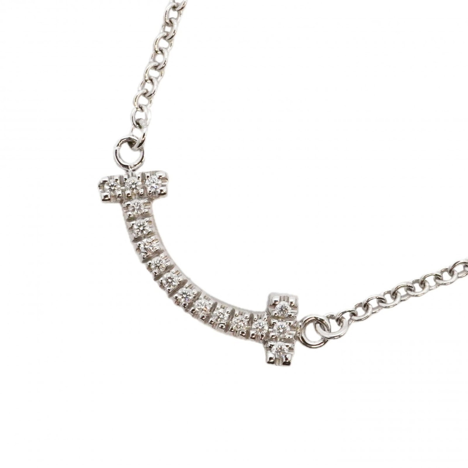 Mini 18Kwg White Gold Diamond Necklace T Smile Women'S Tiffany: Mini 18Kwg White Gold Diamond Necklace T Smile Women'S Tiffany 18K white gold and diamond necklace from Tiffany, featuring a 4.7mm x 14.7mm pendant with a subtle sparkle. The chain's 40.5-45 cm length