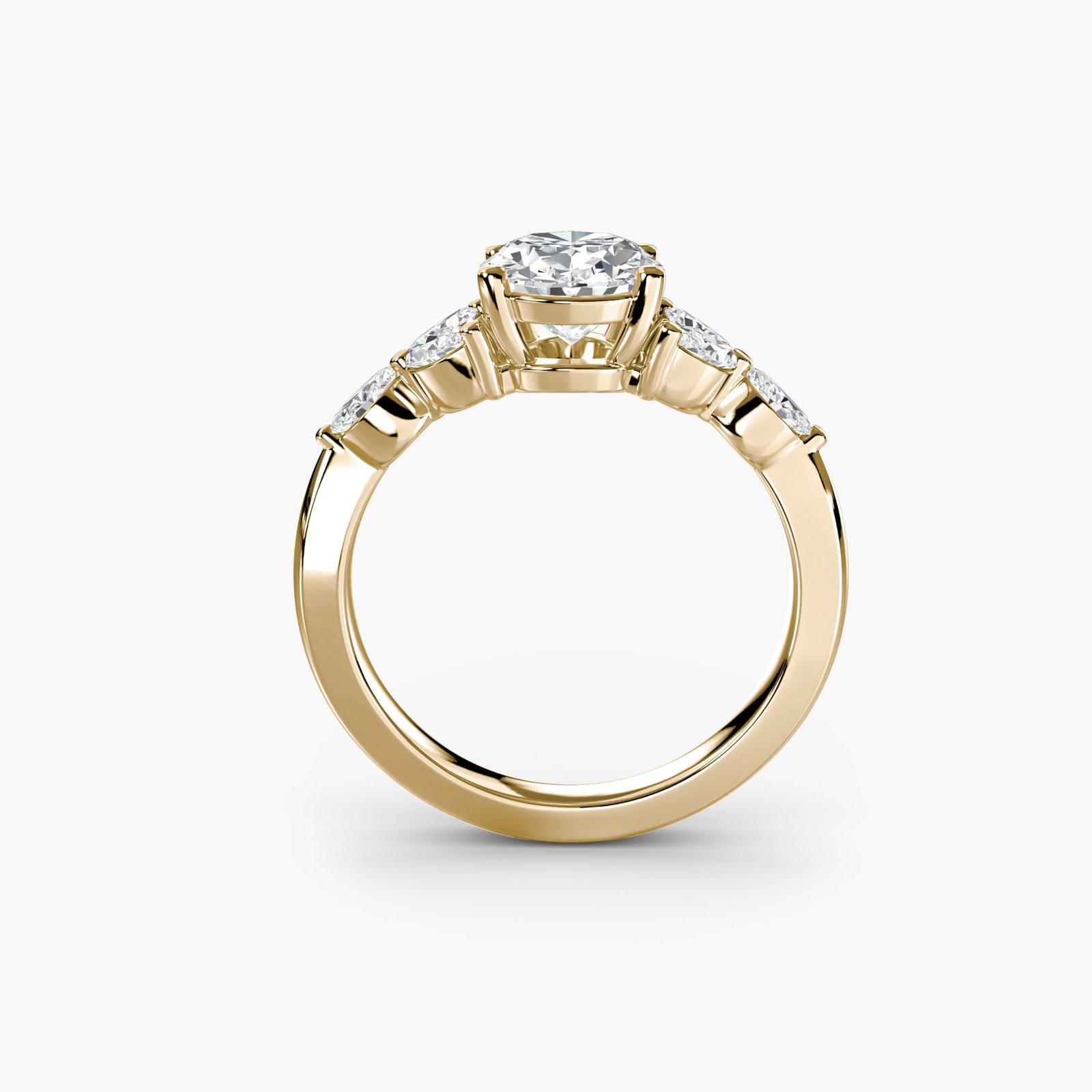 Side Stone Oval 18Kt Yellow Gold Ring Setting: Side Stone Oval 18Kt Yellow Gold Ring Setting Oval ring setting crafted from 18Kt yellow gold, featuring six side stones totaling 0.336 carats in lab-grown EF/VS colour and clarity. The ring's oval
