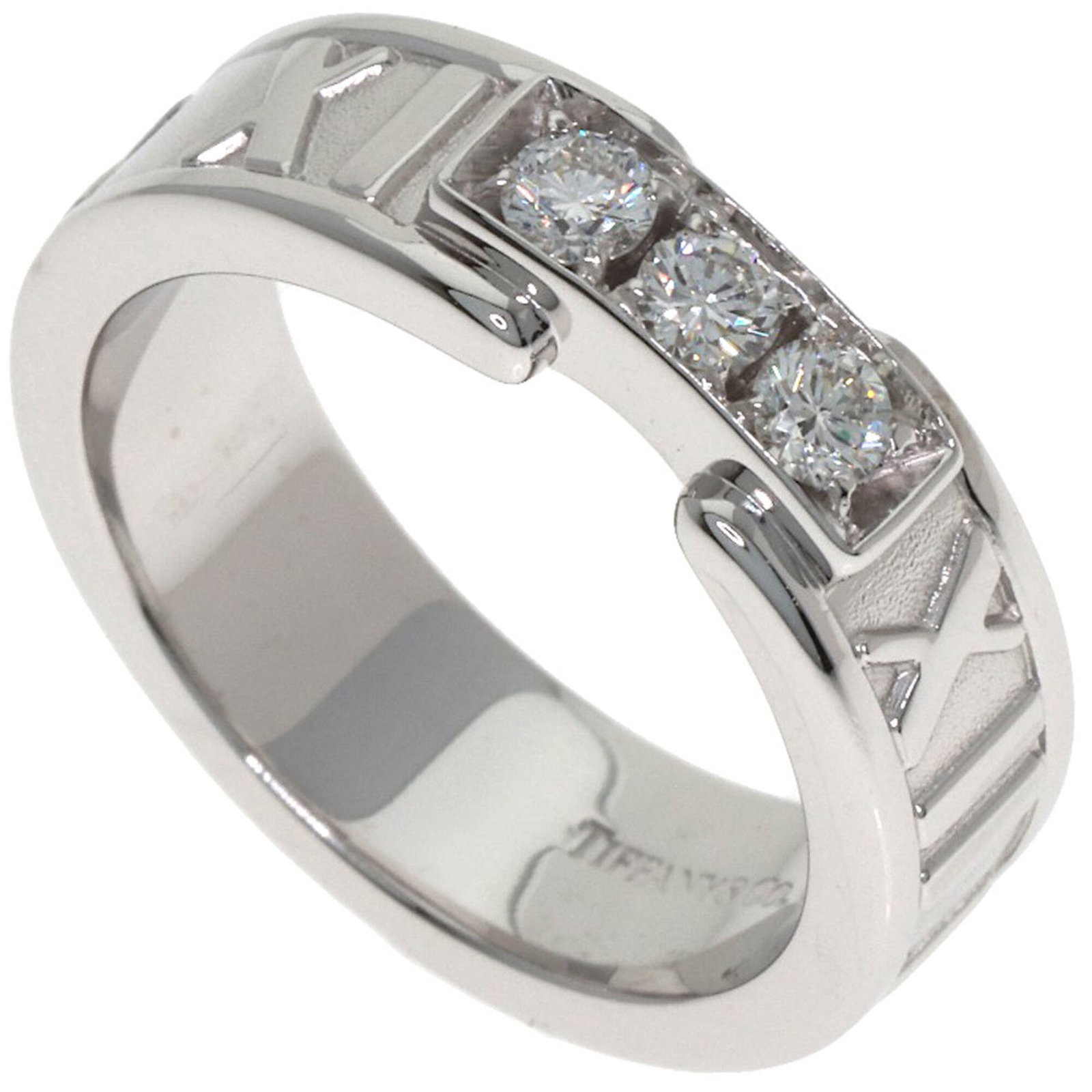 Tiffany Band Ring White Gold (18K): Tiffany Band Ring White Gold (18K) Tiffany Band Ring White Gold (18K) features a diamond stone set in an 18k white gold band, measuring 5.3mm in width and weighing 6.8g. This used ring is in very good