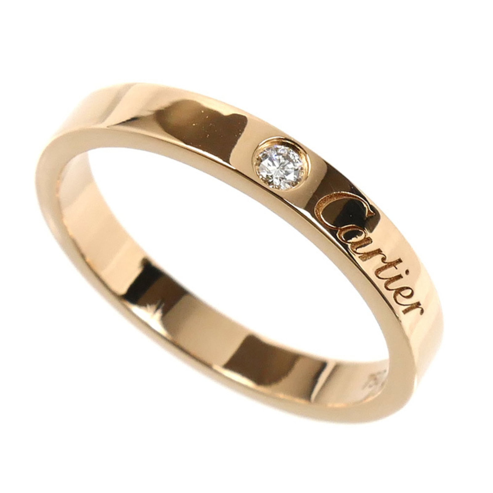 Pink gold 18k ring band from Cartier: Pink gold 18k ring band from Cartier Pink gold 18k Cartier ring band features a diamond stone and boasts the luxury brand's signature style. The item has some minor signs of wear, including scratches