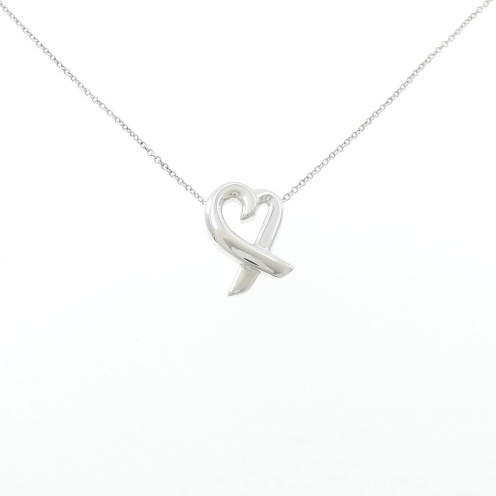Small Loving Heart Necklace by Tiffany: Small Loving Heart Necklace by Tiffany Small Loving Heart Necklace by Tiffany, crafted from sterling silver 925, features a delicate pendant measuring 16.1mm x 11.6mm. This lovely necklace boasts a