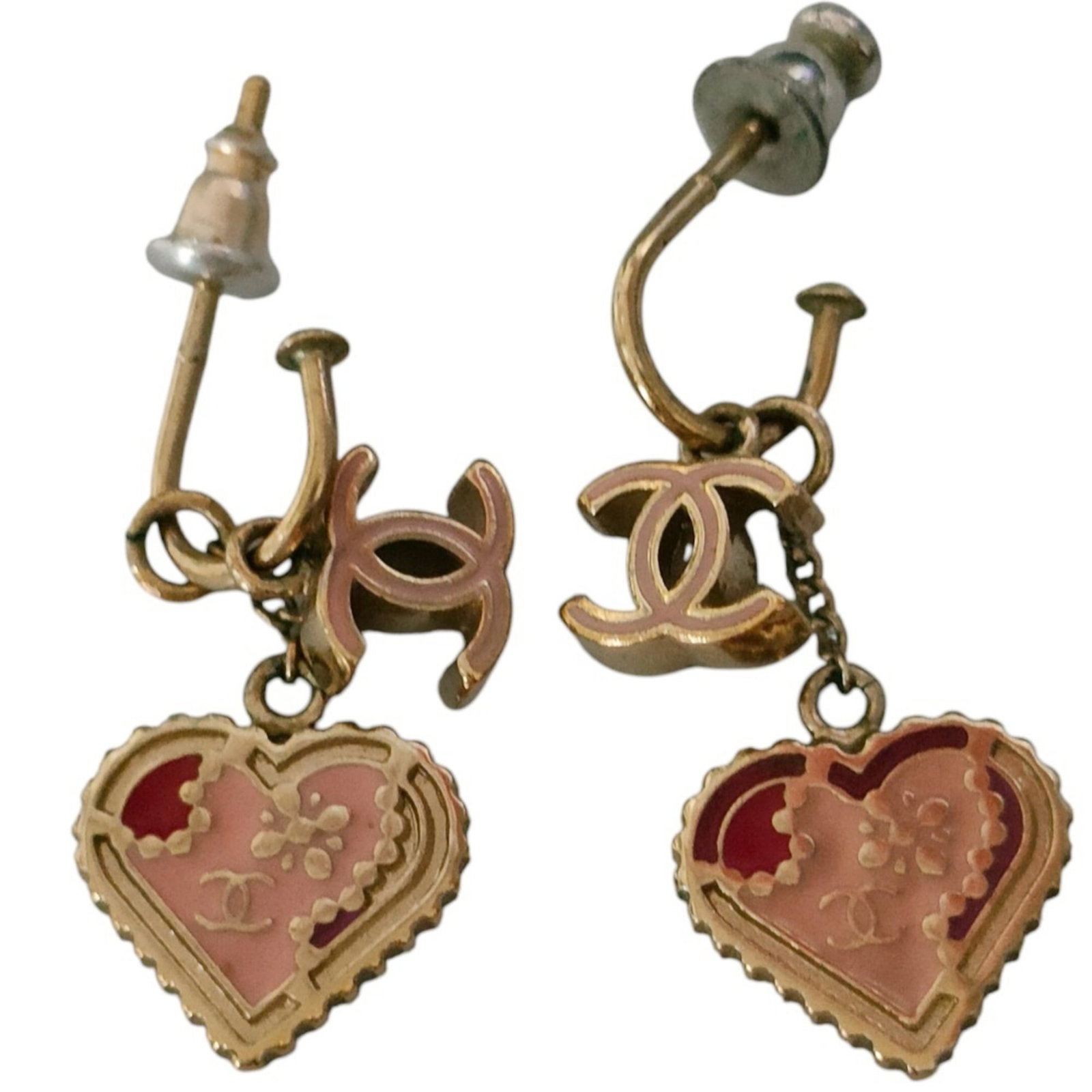 Stud Earrings Metal by Chanel: Stud Earrings Metal by Chanel Stud earrings by Chanel in gold, pink, and red hues, featuring a metal design with subtle scratches and minor dirt marks. The condition reflects some signs of usage but o