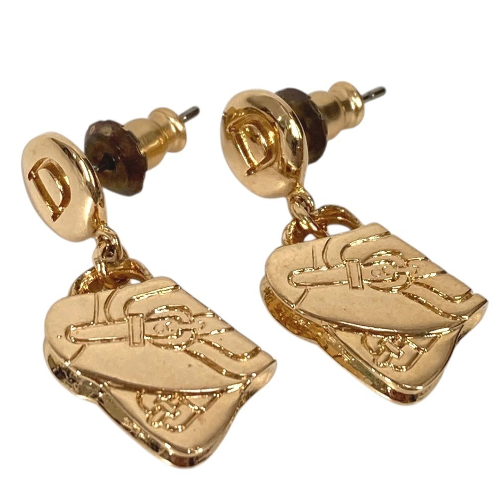 Dior Christian Metal Drop Earrings: Dior Christian Metal Drop Earrings Gold Christian Dior Metal Drop Earrings are a statement piece, featuring the iconic brand's signature style. With traces of usage and minor damages visible, these ea
