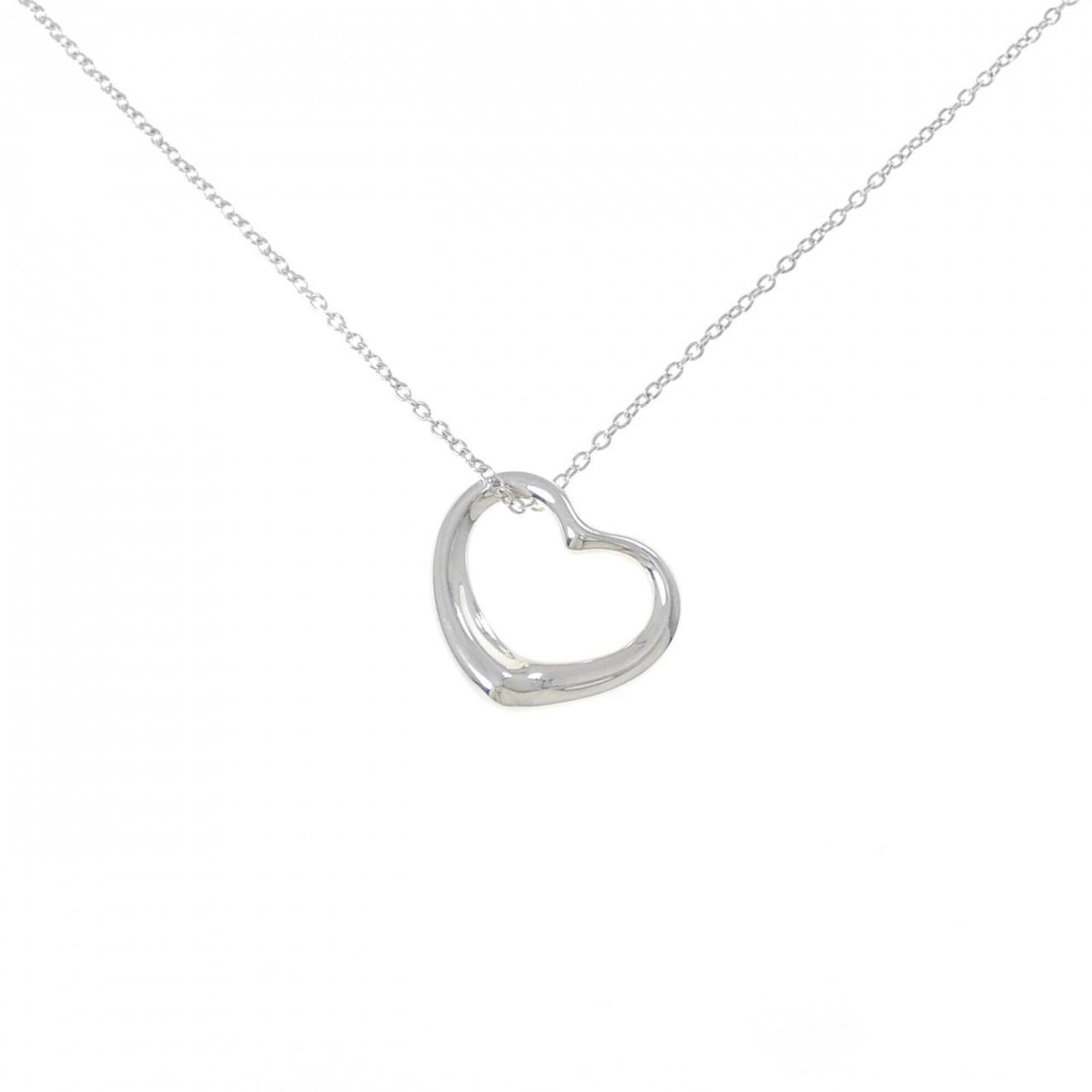Heart Open Tiffany Necklace: Heart Open Tiffany Necklace Silver 925 Heart Open Tiffany Necklace with a pendant size of 20.5mm x 20.5mm and a hardy used condition, bearing little traces of usage. The necklace features a nice item