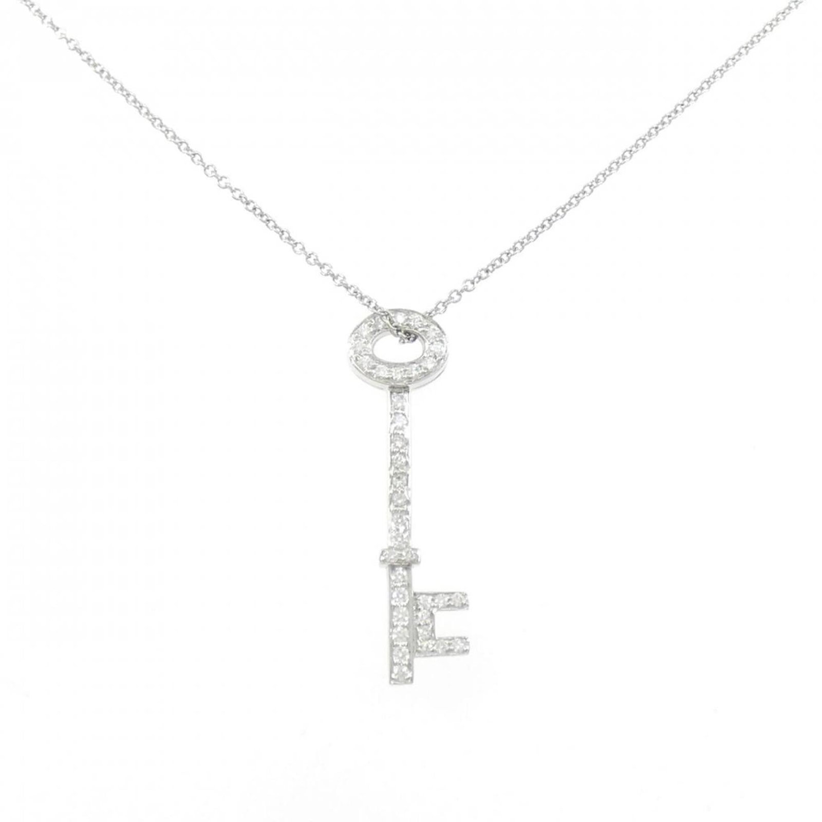 Oval Key Tiffany Necklace: Oval Key Tiffany Necklace Oval Key Tiffany Necklace features a stunning platinum pendant adorned with a diamond, measuring 30.4mm x 9.9mm. The necklace boasts a sleek design with a platinum stone and