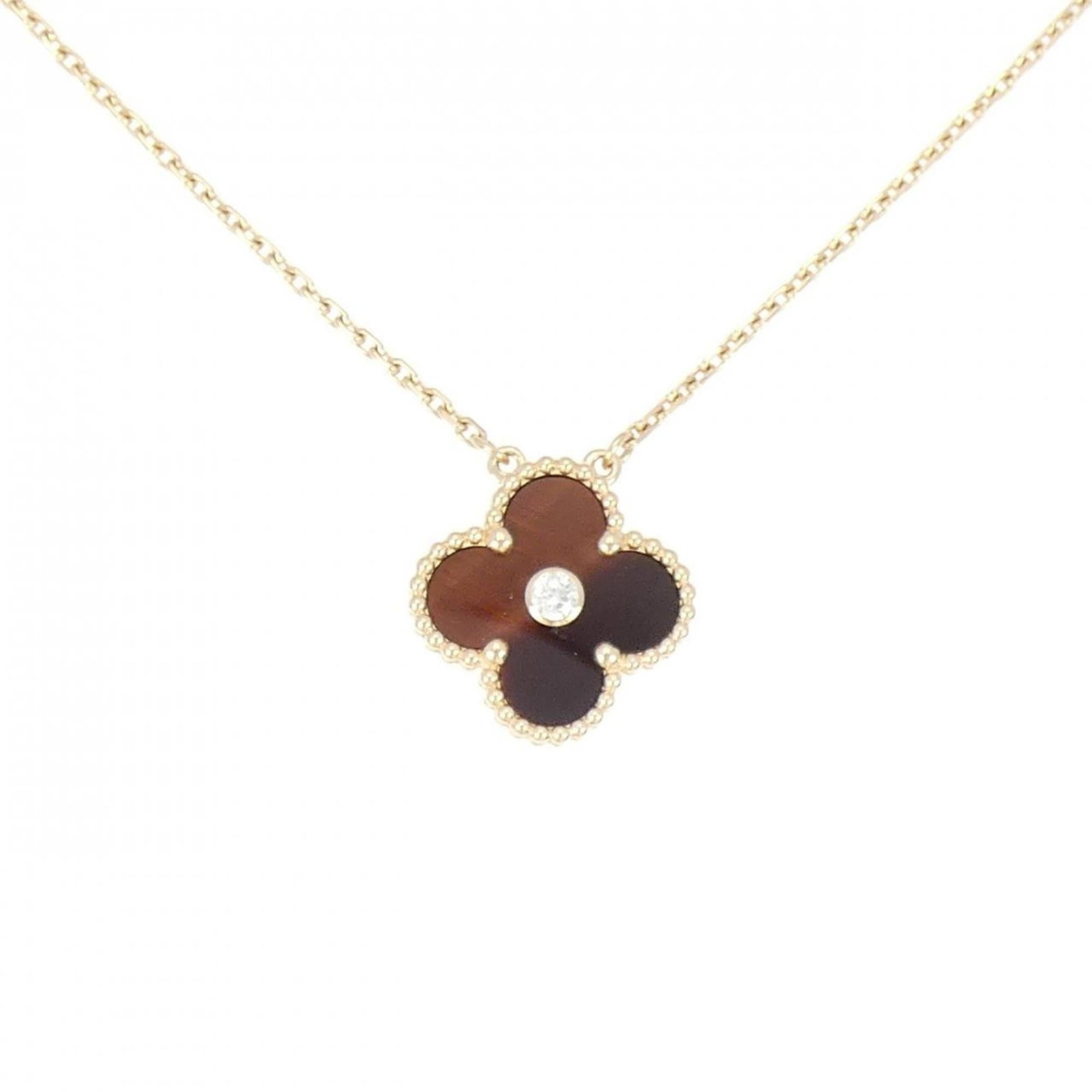 Vintage Alhambra Van Cleef Necklace: Vintage Alhambra Van Cleef Necklace Pink gold (18K) pendant featuring a 6.2g diamond, set in a classic Van Cleef & Arpels Alhambra design. The necklace boasts a timeless elegance with its intricate
