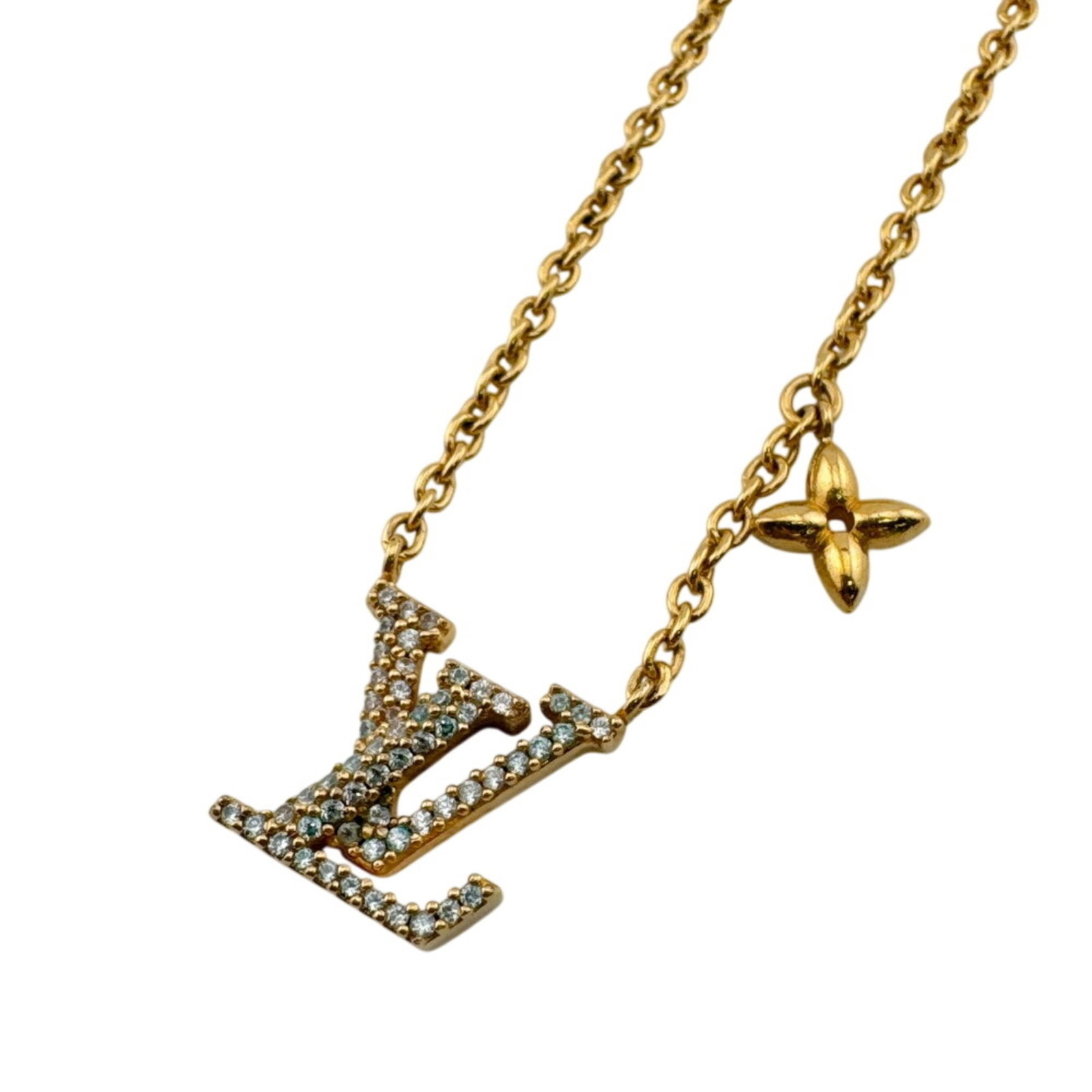 Louis Vuitton M00596 Iconic Lv Necklace Chain Gold: Louis Vuitton M00596 Iconic Lv Necklace Chain Gold Gold chain necklace from Louis Vuitton, featuring the iconic Lv monogram pattern. The 27.5 cm long chain has traces of usage and minor scratches,