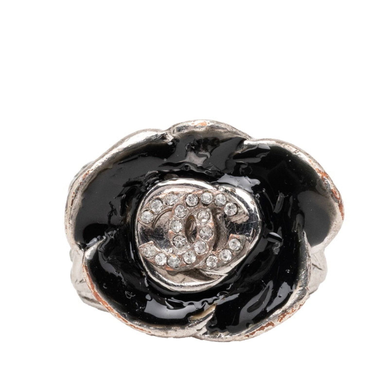 Metal enamel ring band Chanel: Metal enamel ring band Chanel Metal enamel ring band from Chanel features black and silver tones, with rhinestone accents. The band has been worn and shows signs of usage, including scratches and