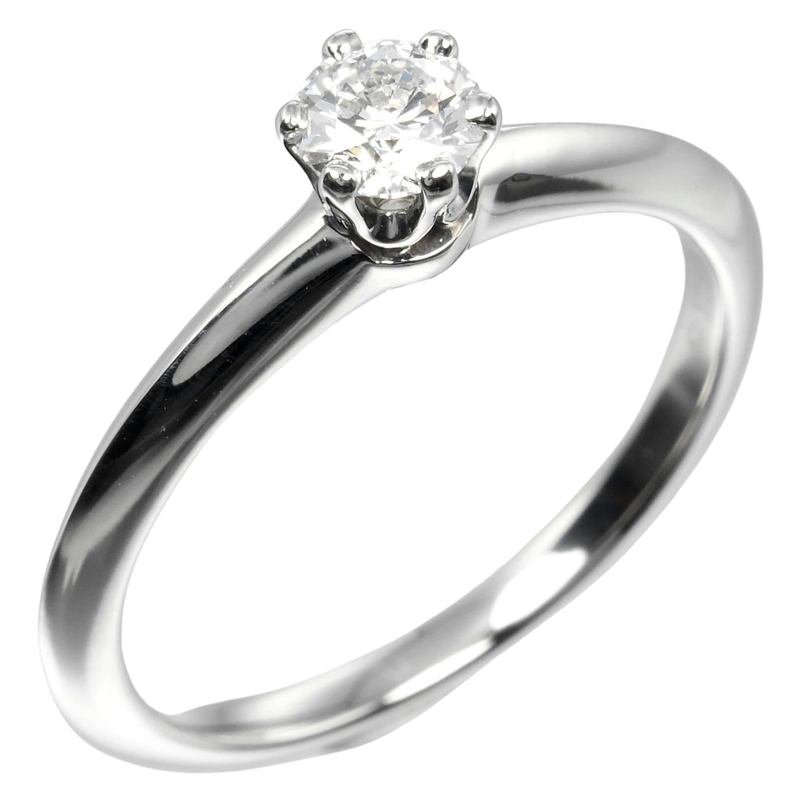 Platinum ring by Tiffany band: Platinum ring by Tiffany band Platinum ring by Tiffany features a diamond stone weighing 0.26 carats, set in a band ring with an inner diameter of 15.60mm and a width of 4.7mm. The item is made from p