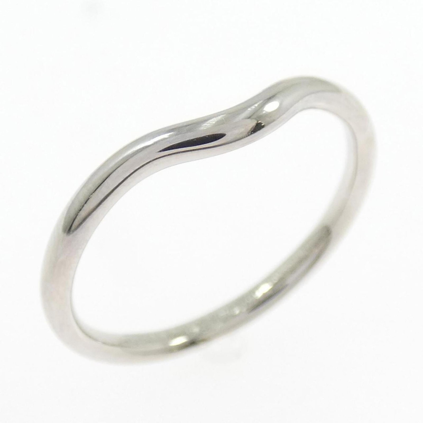 Platinum ring by Tiffany band: Platinum ring by Tiffany band Platinum ring by Tiffany features a sleek band design made from high-quality platinum. The item has some minor scratches and dirt, but overall remains in very good condit