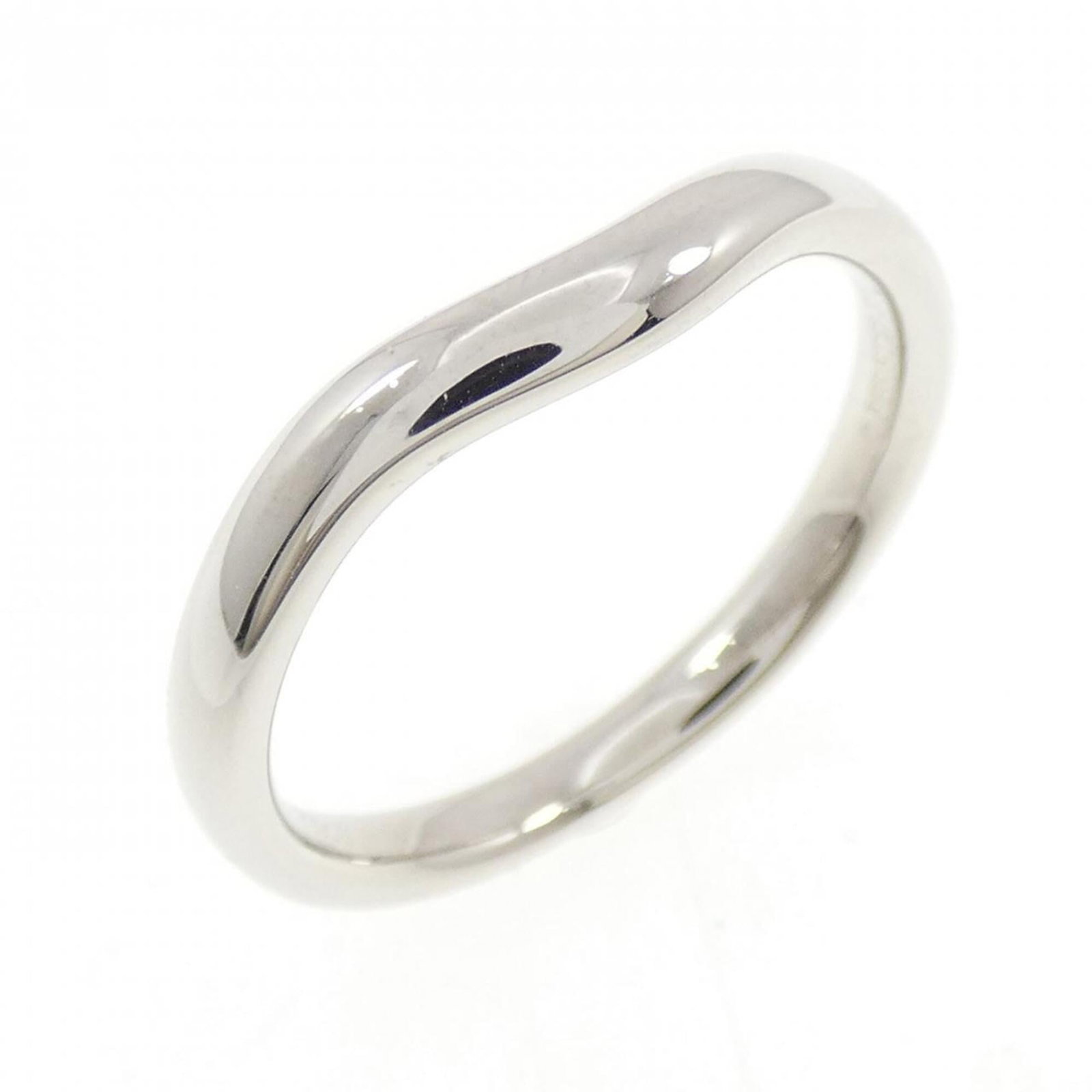 Platinum ring by Tiffany band: Platinum ring by Tiffany band Platinum ring by Tiffany features a band style design made from high-quality platinum. The item shows some signs of usage, including minor scratches and dirt, but remains