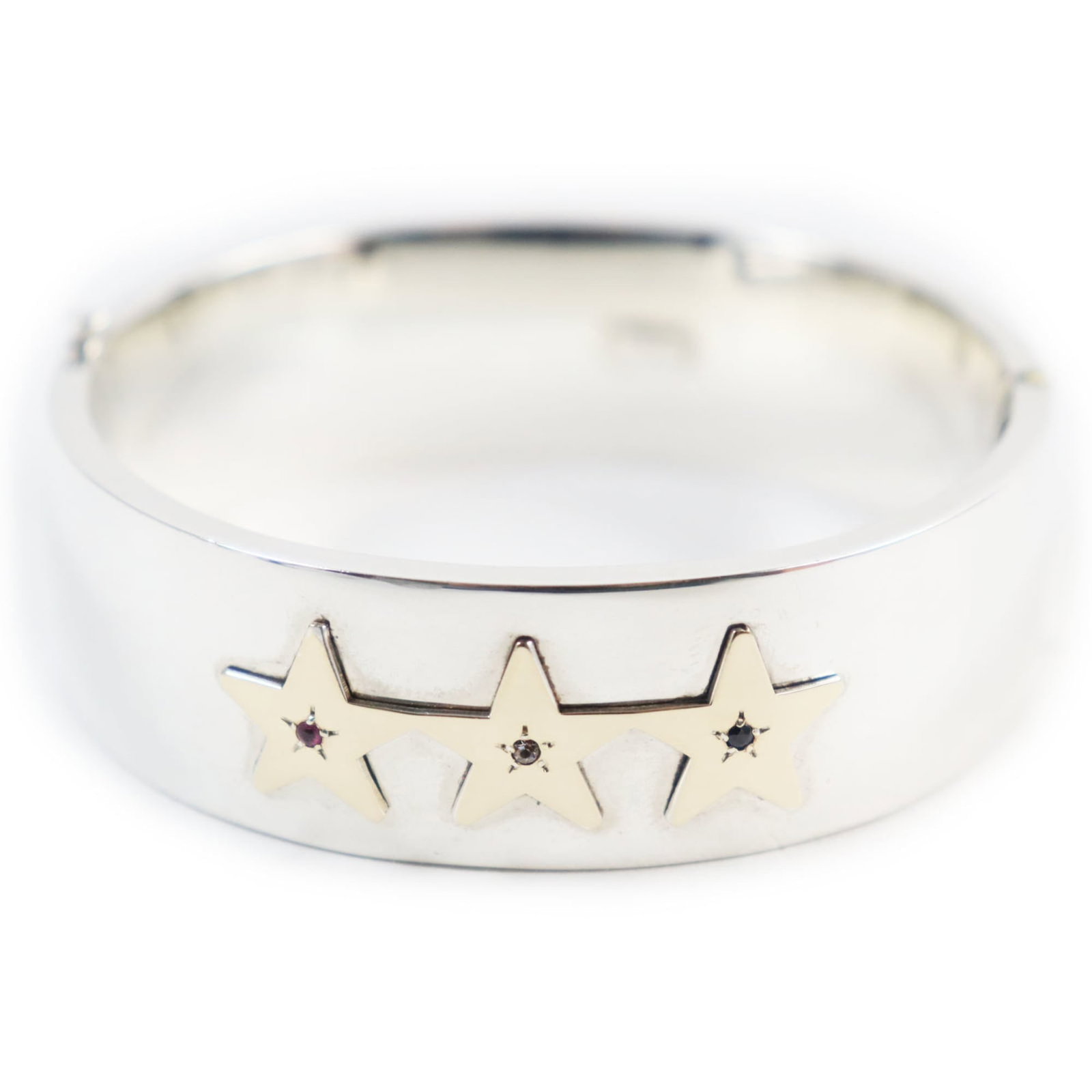 Tiffany Bangle: Tiffany Bangle Tiffany's gold bangle boasts an impressive array of precious stones, including diamond, ruby, and sapphire. The elegant design measures 17.5cm in length and 1.9cm in width, weighing a