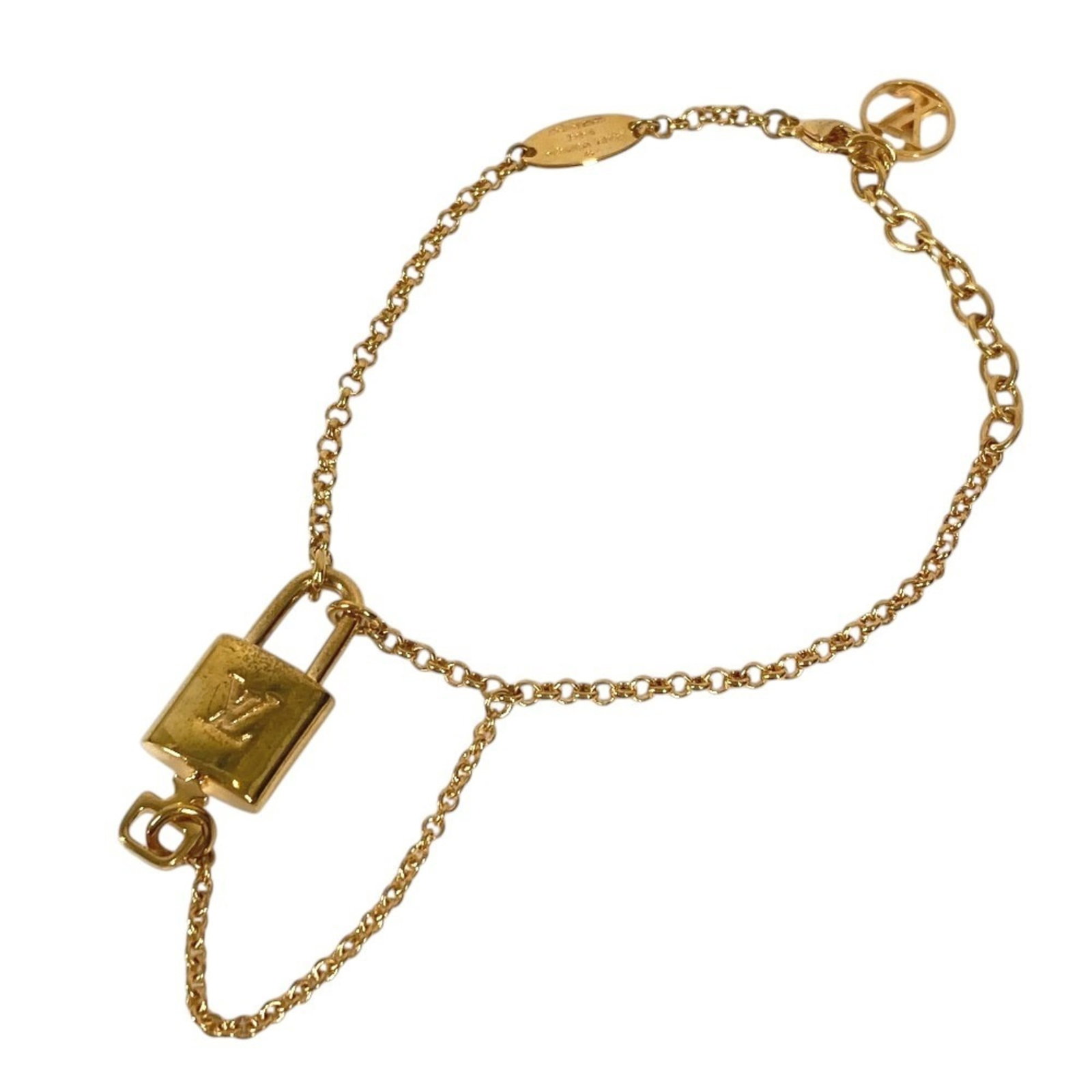 Charm of Louis Vuitton Metal: Charm of Louis Vuitton Metal Gold Louis Vuitton Metal Charm Bracelet, 19.5cm in length, bears the signature of its creator and features a classic design that exudes timeless elegance. The bracelet has