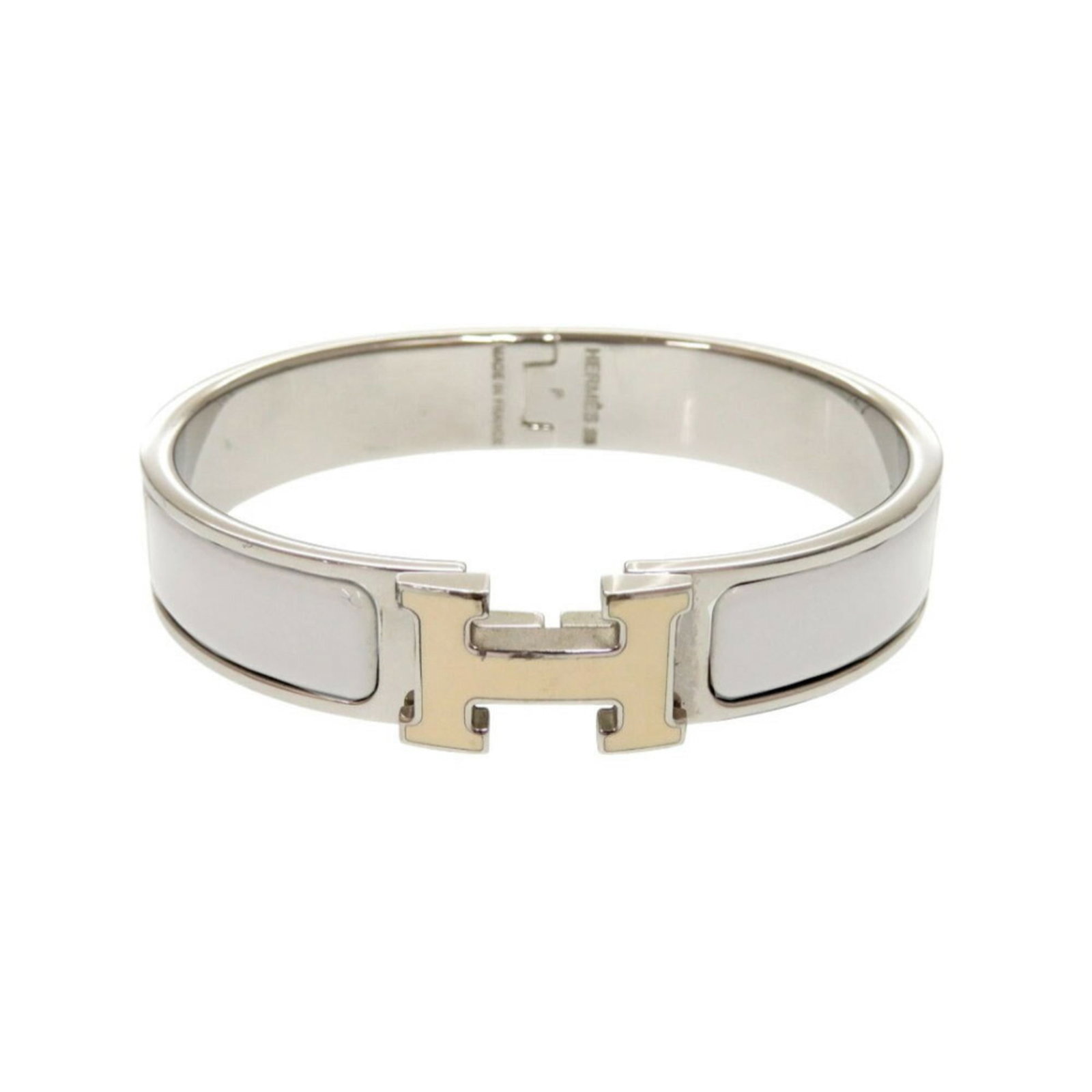 Metal Bangle Hermes: Metal Bangle Hermes Gray and silver metal bangle from Hermes, measuring 16cm in length. The bangle bears some scratches and dirt, but remains in very good condition with a few traces of usage visible.