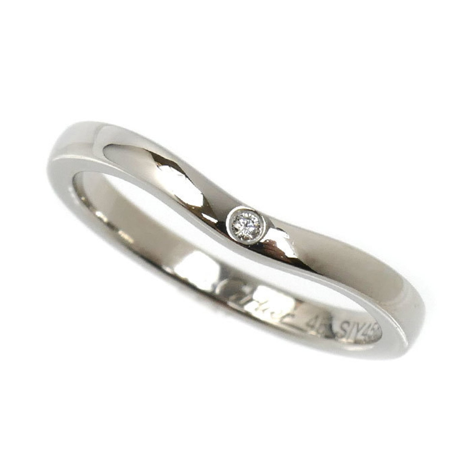 Ring Band by Platinum 950: Ring Band by Platinum 950 Made from platinum 950, this Cartier ring band features a diamond stone and boasts a classic design. The band itself has some minor scratches and dirt, but remains in very go