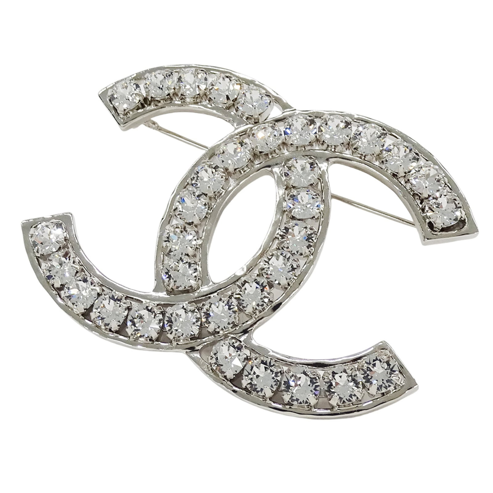 Metal rhinestone Chanel brooch: Metal rhinestone Chanel brooch Silver metal rhinestone Chanel brooch with a large size, measuring 49cm x 66cm. The brooch bears traces of usage and minor scratches/dirt, but remains in good condition