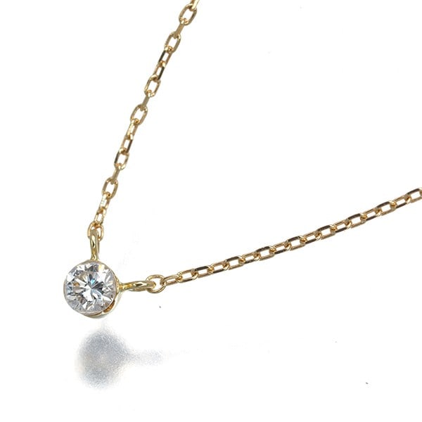 Diamond 0.05Ct Solitaire 18K 750 Ahkah Yellow Gold: Diamond 0.05Ct Solitaire 18K 750 Ahkah Yellow Gold 18k yellow gold necklace showcases a natural diamond solitaire, with the 0.05 carat stone set in a simple yet elegant design. The AHKAH brand's