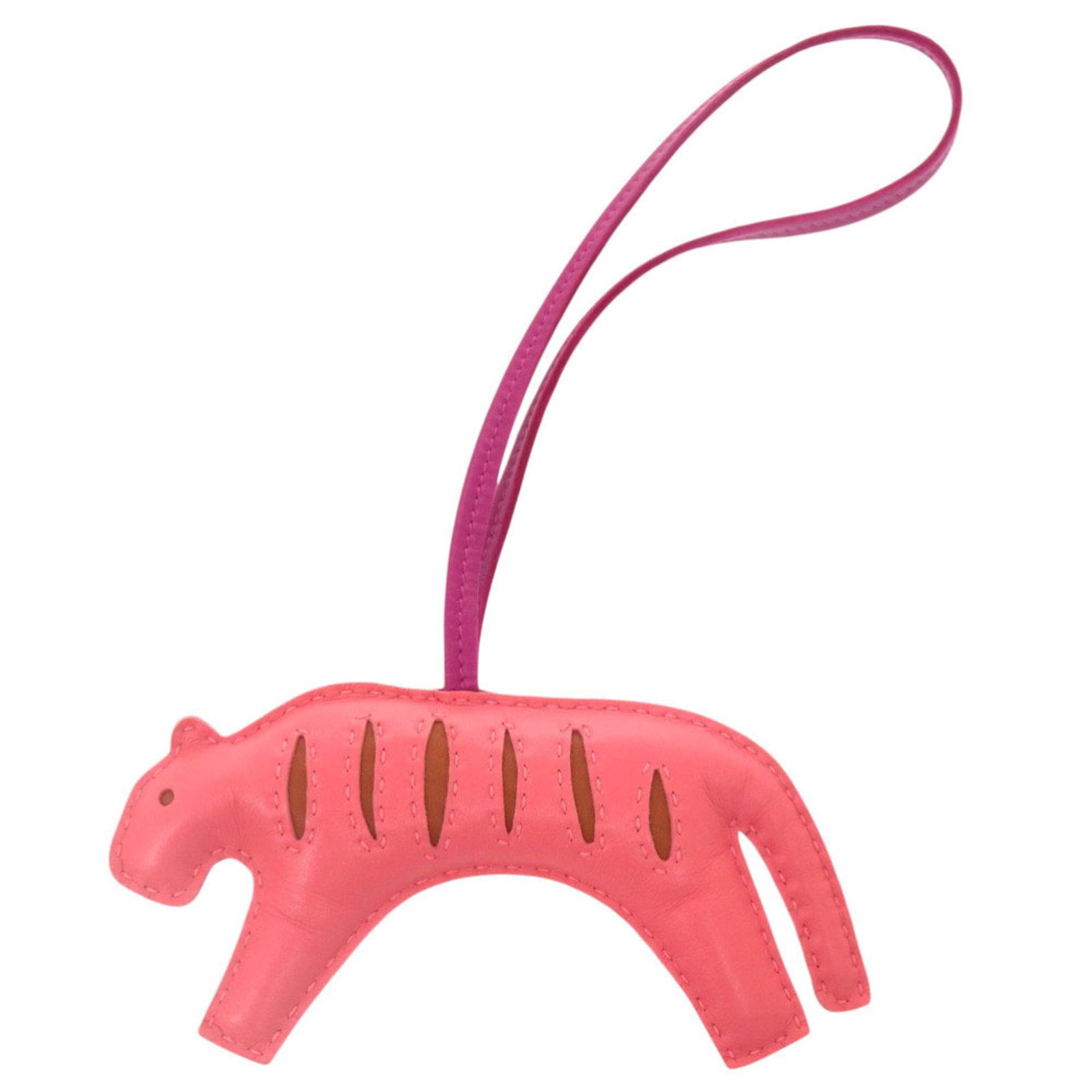 Hermes Handbag Charm Agneau Milo: Hermes Handbag Charm Agneau Milo Agneau Milo charm from Hermes, a pink handbag charm with a few traces of usage and some scratches. The charm bears a signature but details on the owner are unknown. In
