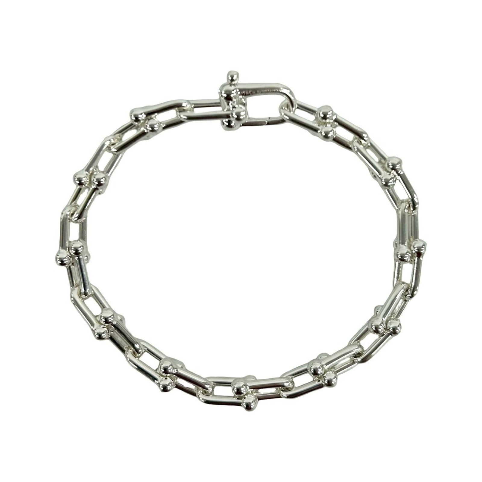 Charm Tiffany Bracelet 925 Silver: Charm Tiffany Bracelet 925 Silver Charm Tiffany Bracelet 925 Silver features a silver 925 material and has a length of 17cm / 6.69''. The bracelet bears traces of usage, scratches, and dirt but remain