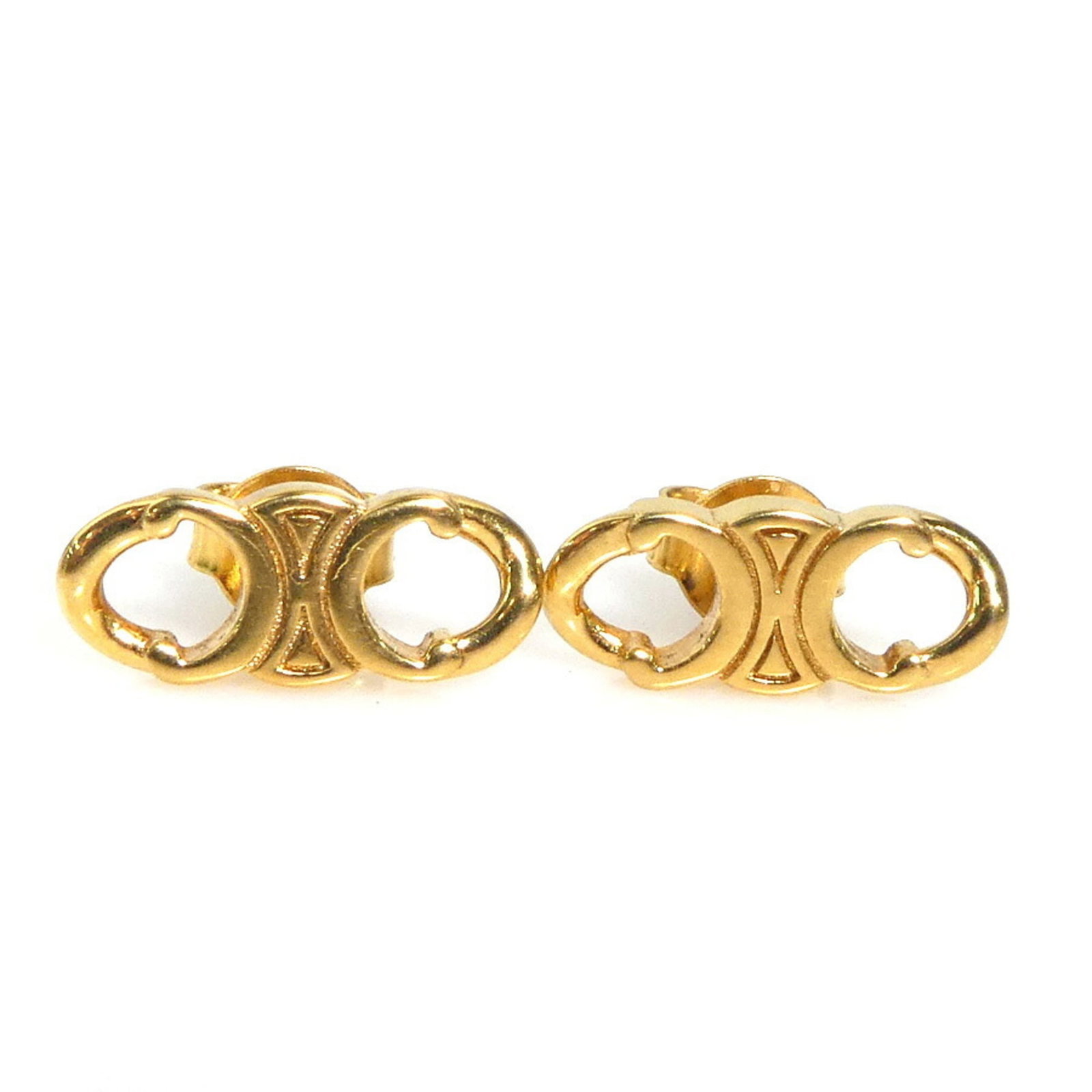 Celine Stud Metal Earrings: Celine Stud Metal Earrings Stud metal earrings in gold finish, measuring 6.00mm x 14.00mm, bearing a signature. The earrings have some scratches and dirt, but are otherwise in very good condition with