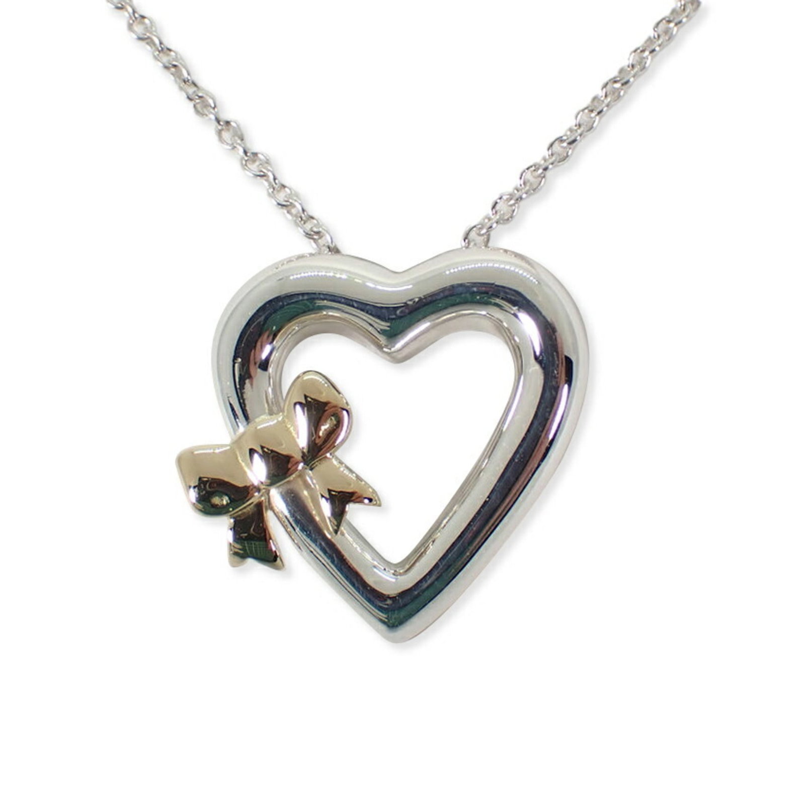 Tiffany 925 750 Heart Ribbon Pendant Necklace: Tiffany 925 750 Heart Ribbon Pendant Necklace Sterling silver and yellow gold 18K heart-shaped pendant, set in a 925 chain necklace with a 45.5 cm circumference. The pendant measures 19mm x 18.6mm and