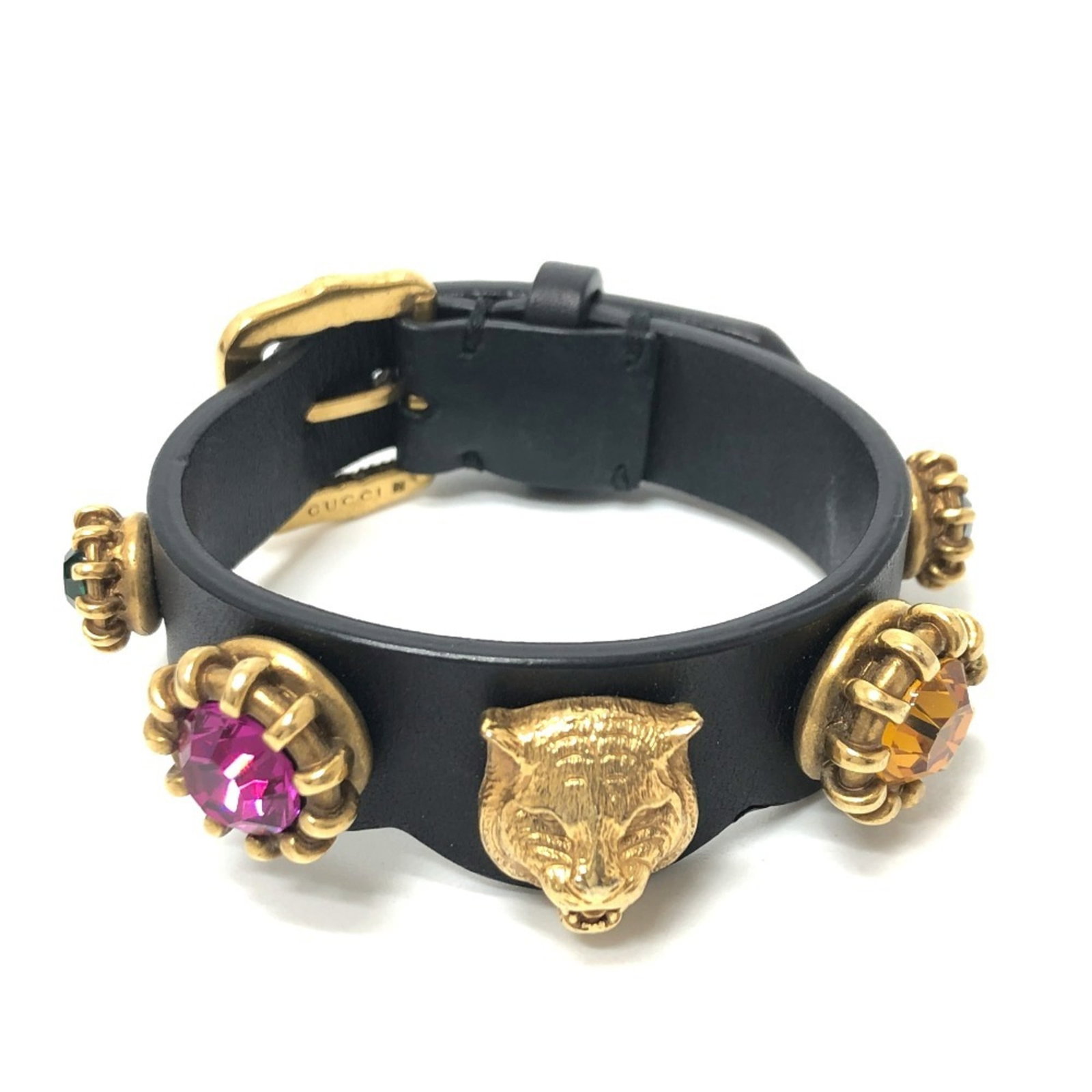Charm Leather Gucci: Charm Leather Gucci Charm Leather Gucci bracelet in black, gold, and multi-color features a classic design with leather material. The 16cm length provides a comfortable fit, while the used condition s