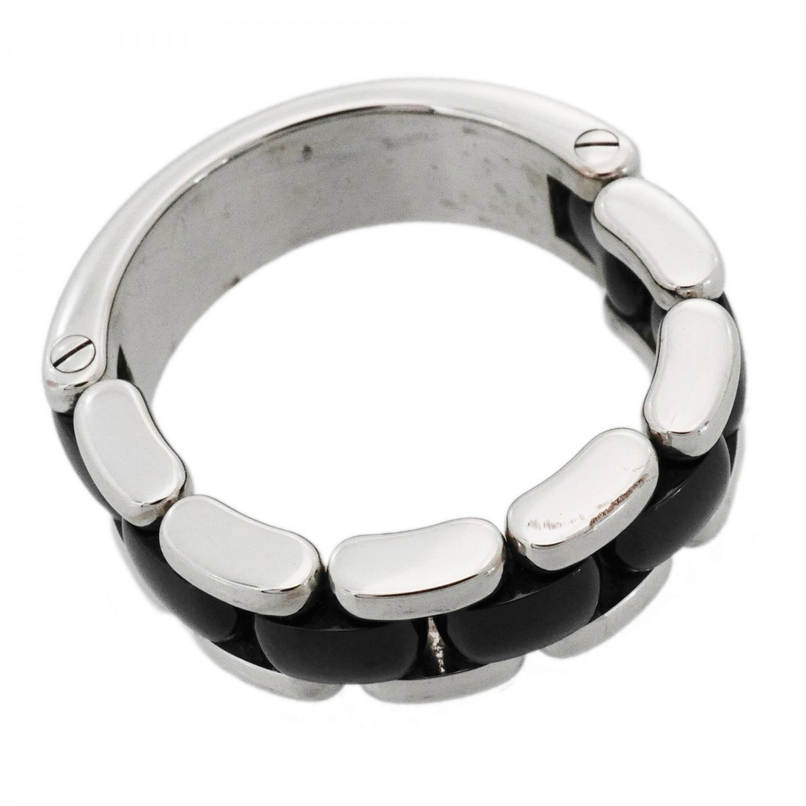 White Ceramic Gold Ring Chanel Band 18K: White Ceramic Gold Ring Chanel Band 18K This 18K white gold band ring features a striking black ceramic design, showcasing the iconic Chanel style. The ring bears a signature and has been crafted