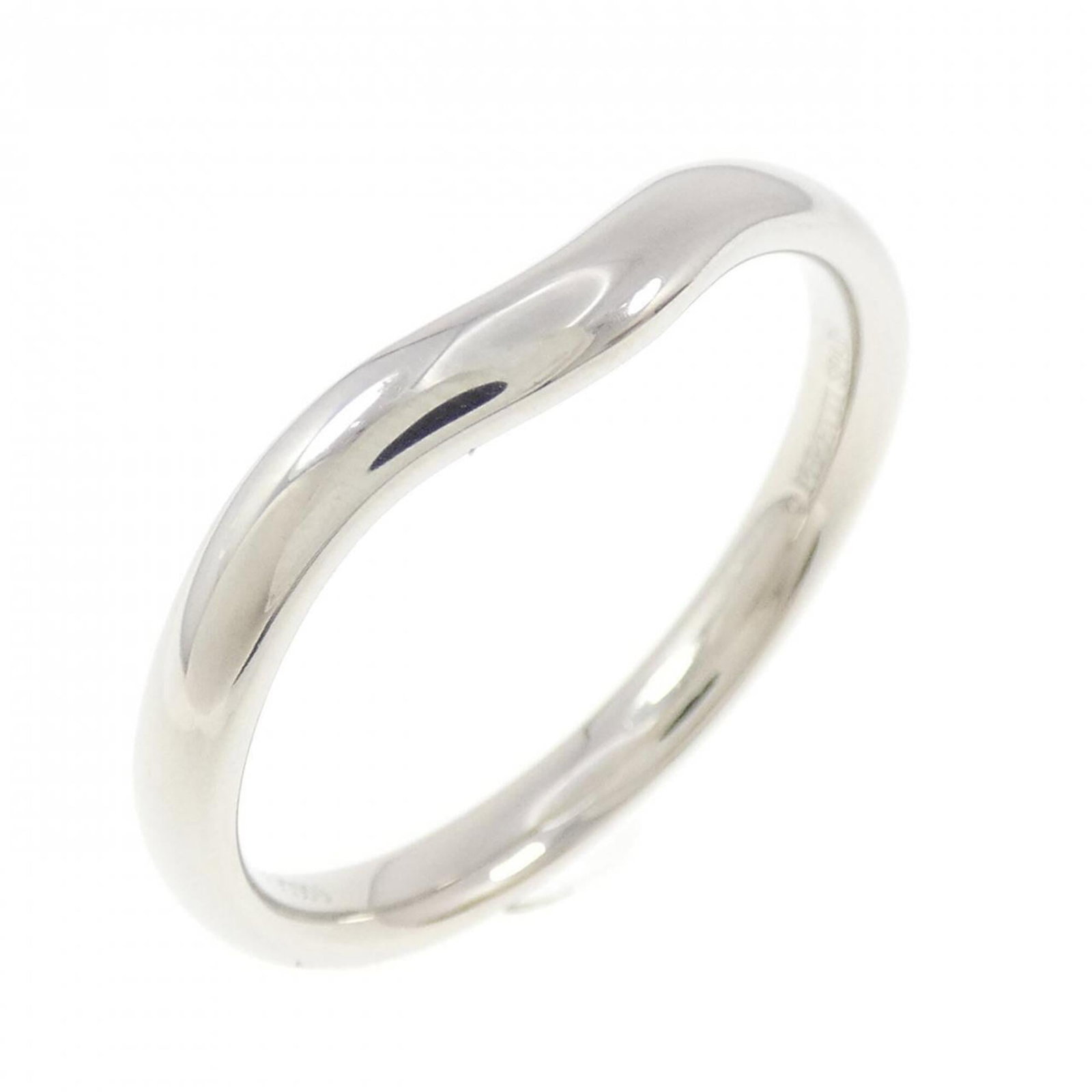 Platinum ring by Tiffany band: Platinum ring by Tiffany band Platinum ring by Tiffany features a sleek band design made from high-quality platinum. The item shows some signs of usage, with minor scratches and dirt, but remains in