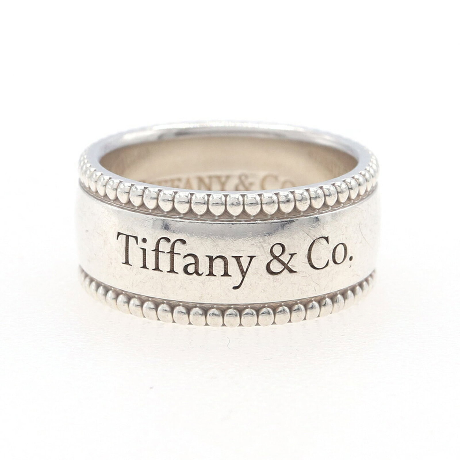 Sterling Silver Ring Tiffany Band: Sterling Silver Ring Tiffany Band Sterling Silver Ring Tiffany Band - A Timeless Classic. This 925 sterling silver ring features a timeless design from the iconic Tiffany brand, with subtle scratches 