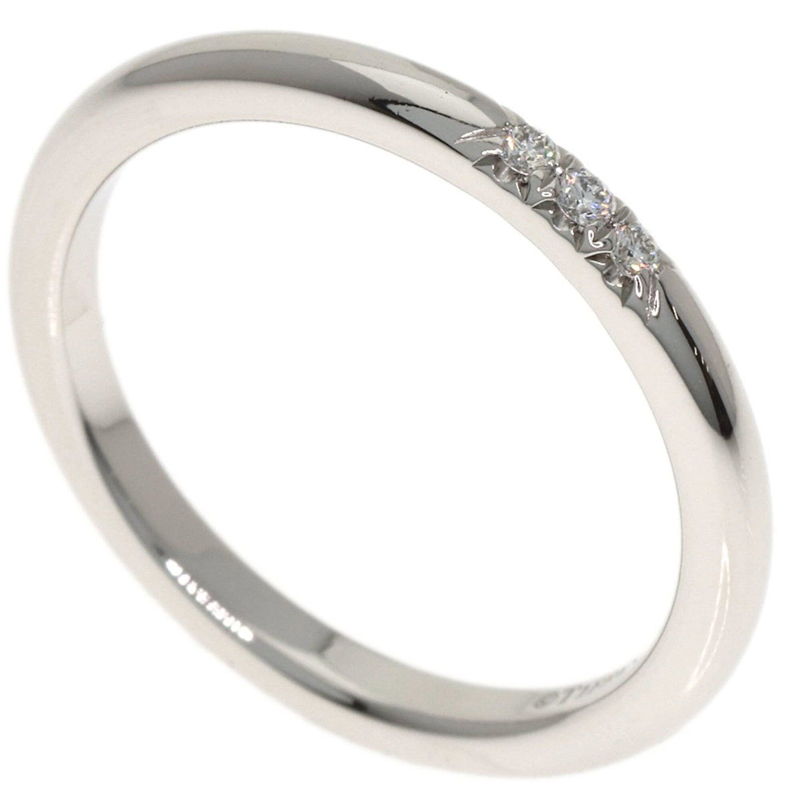 Platinum ring by Tiffany band: Platinum ring by Tiffany band Platinum ring by Tiffany features a diamond stone set in a 950 platinum band, available in women's size US 4. The ring showcases a subtle width of 2mm and weighs