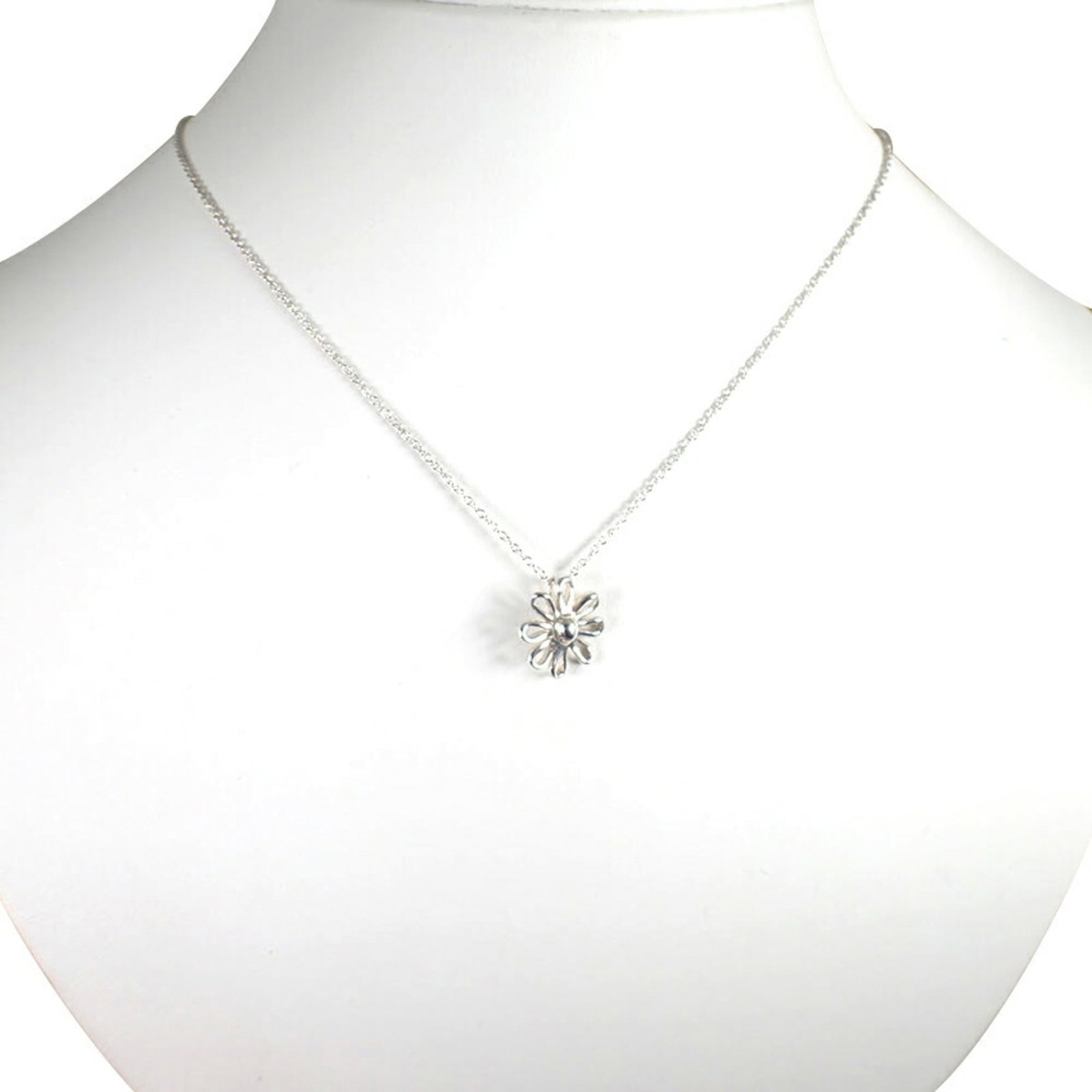 Daisy Tiffany 925 Pendant Necklace: Daisy Tiffany 925 Pendant Necklace Sterling silver pendant necklace with a Tiffany hallmark, crafted from high-quality 925 material. The daisy design features subtle details and a classic style that