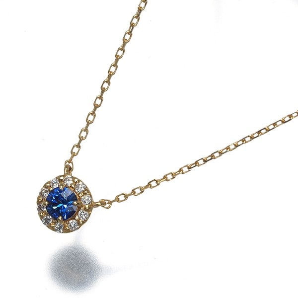Diamond sapphire birth stone necklace in 18K yellow gold: Diamond sapphire birth stone necklace in 18K yellow gold 18k yellow gold pendant showcases a natural sapphire birth stone, set in a beautiful diamond sapphire birth stone necklace. The necklace's 18k