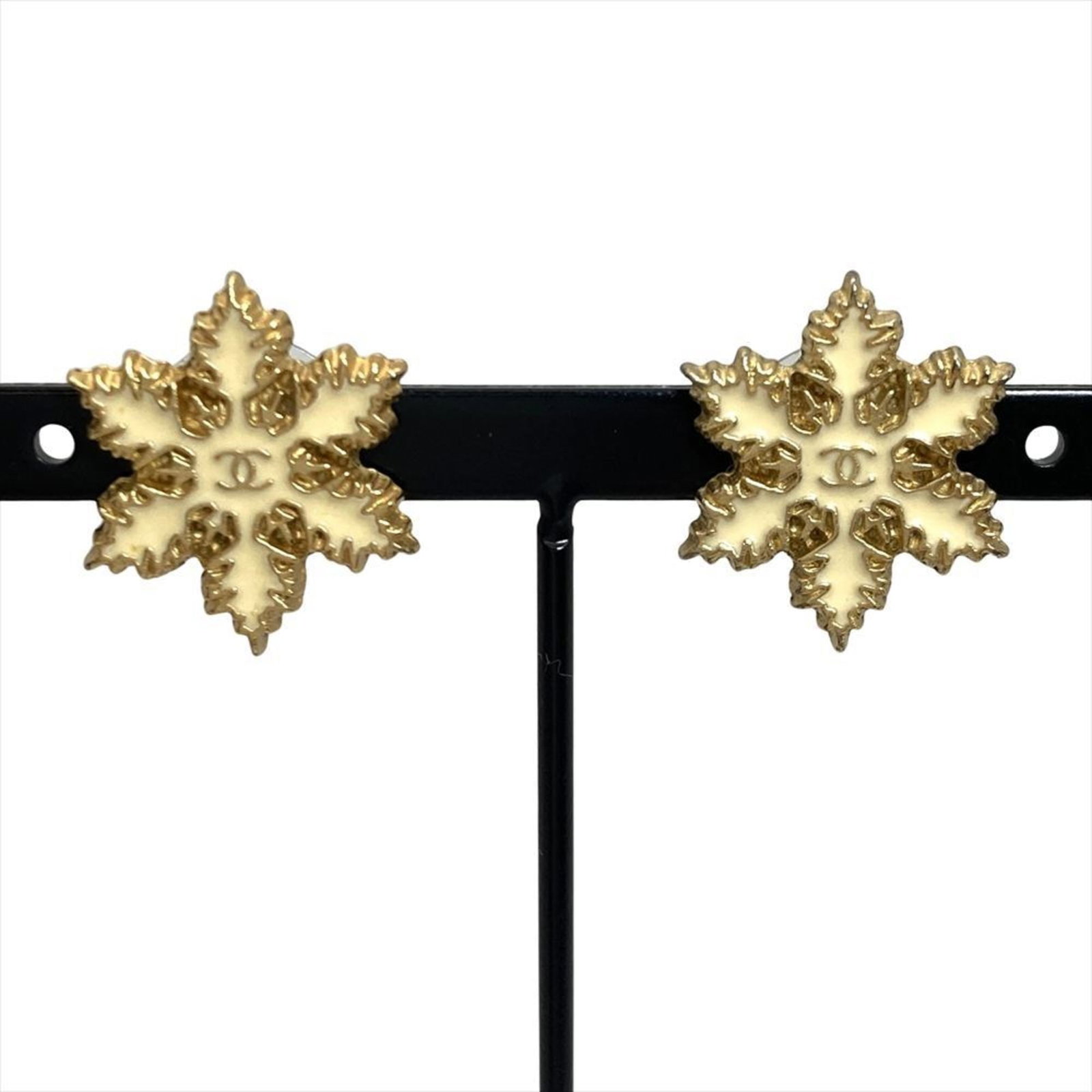 Chanel Stud Earrings: Chanel Stud Earrings Gold Plated Chanel Stud Earrings with Traces of Usage. The earrings feature the iconic Chanel design, measuring 20.00mm x 12.00mm in size. With their gold plated finish and