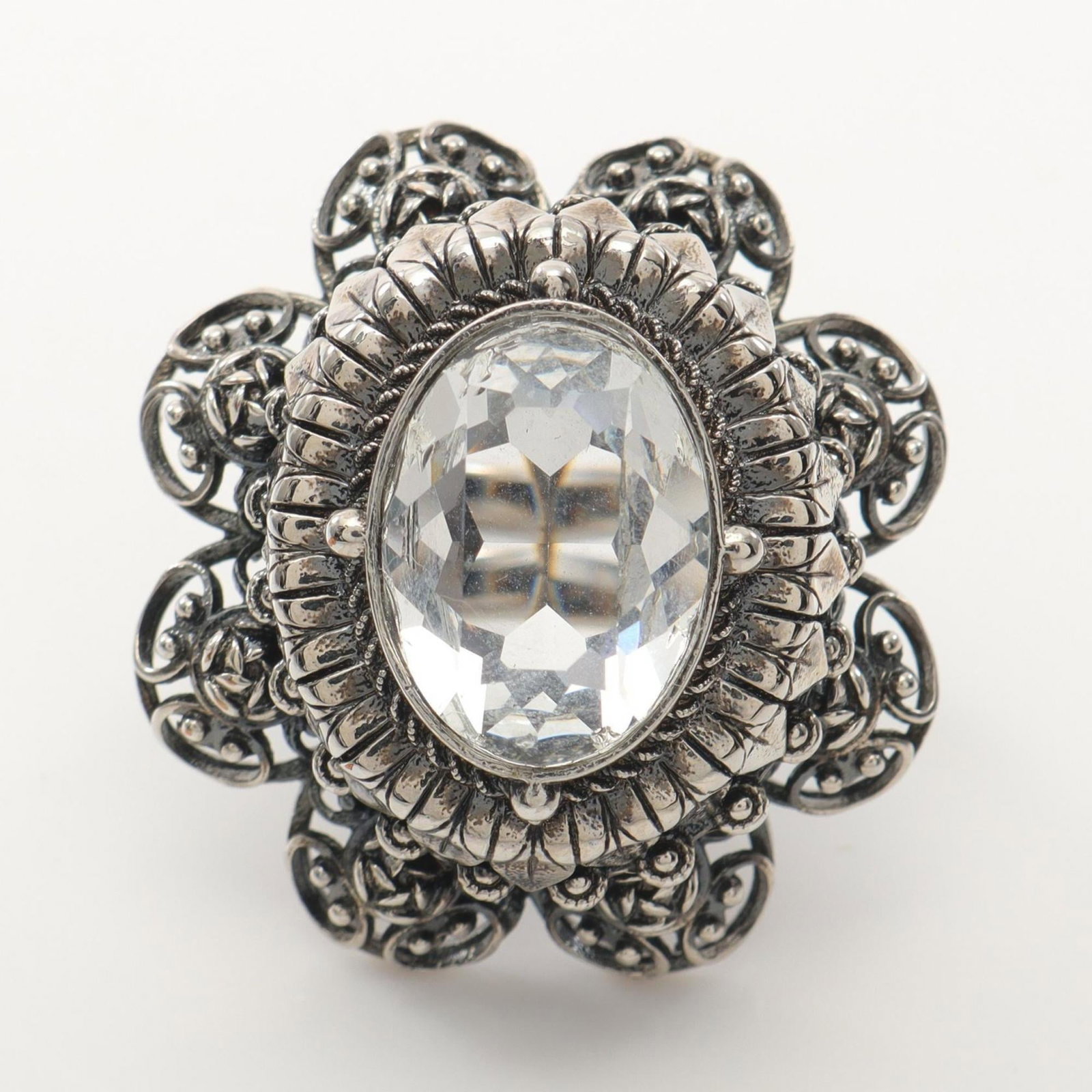 Stainless steel ring by Alexander Mcqueen: Stainless steel ring by Alexander Mcqueen Stainless steel band ring by Alexander McQueen, featuring clear and silver details. This used item shows some signs of wear, with a few scratches and minor