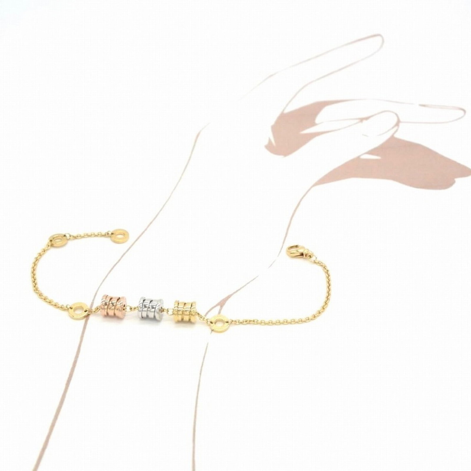 Yellow Gold Charm Bracelet by Bvlgari: Yellow Gold Charm Bracelet by Bvlgari Yellow Gold Charm Bracelet by Bvlgari features 18K yellow gold construction with a total length of 19cm, weighing 8.8g. The bracelet showcases some scratches and