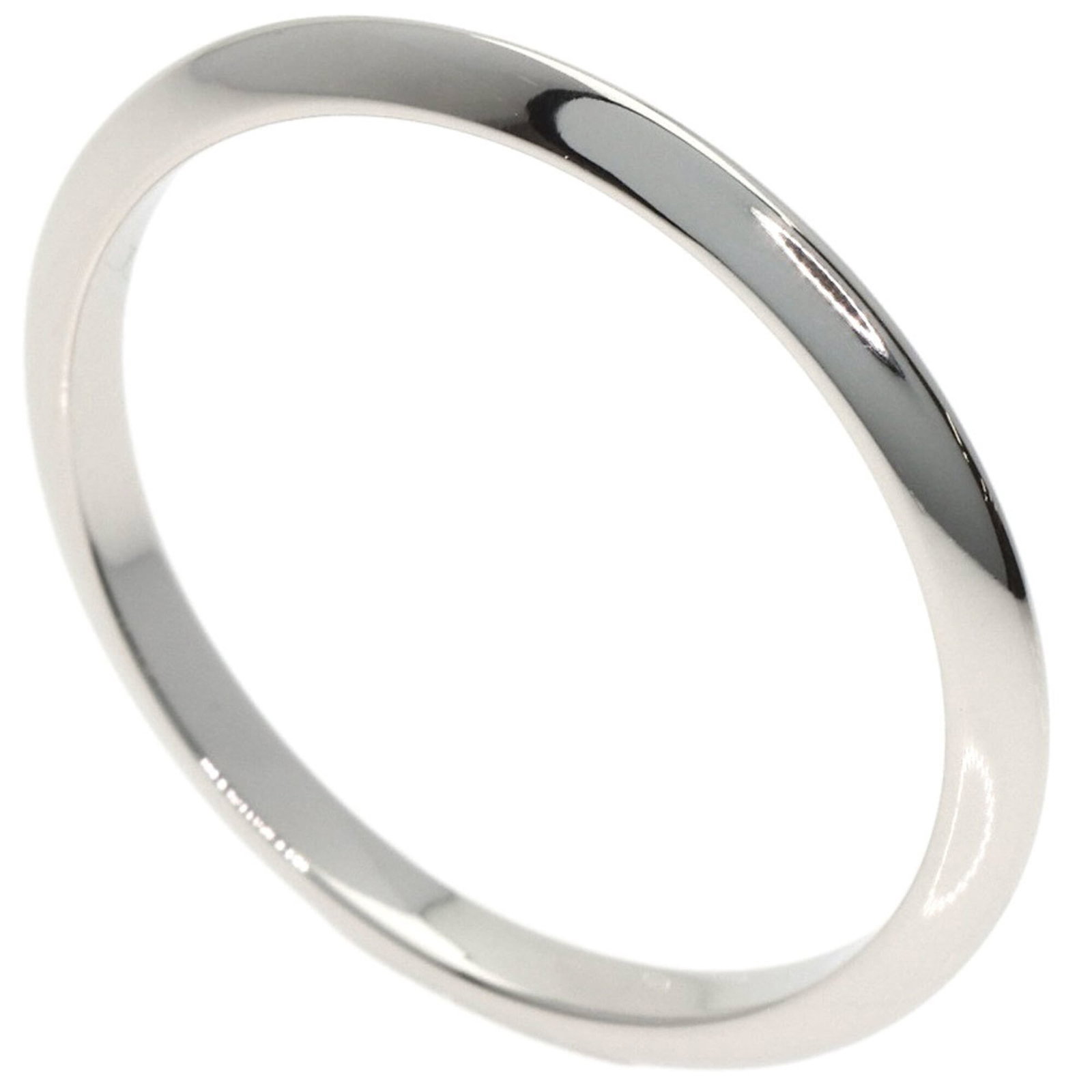 Platinum ring by Tiffany band: Platinum ring by Tiffany band Platinum ring by Tiffany features a band design made from high-quality platinum, available in a women's size 8. The item shows some signs of usage, with minor scratches