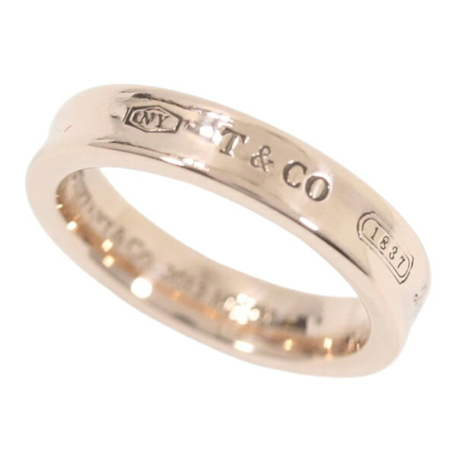 Tiffany Band Ring: Tiffany Band Ring Tiffany Band Ring - A Like New Condition Men's and Women's Accessory. This band ring features the iconic Tiffany brand, with a used condition that still showcases its original qualit