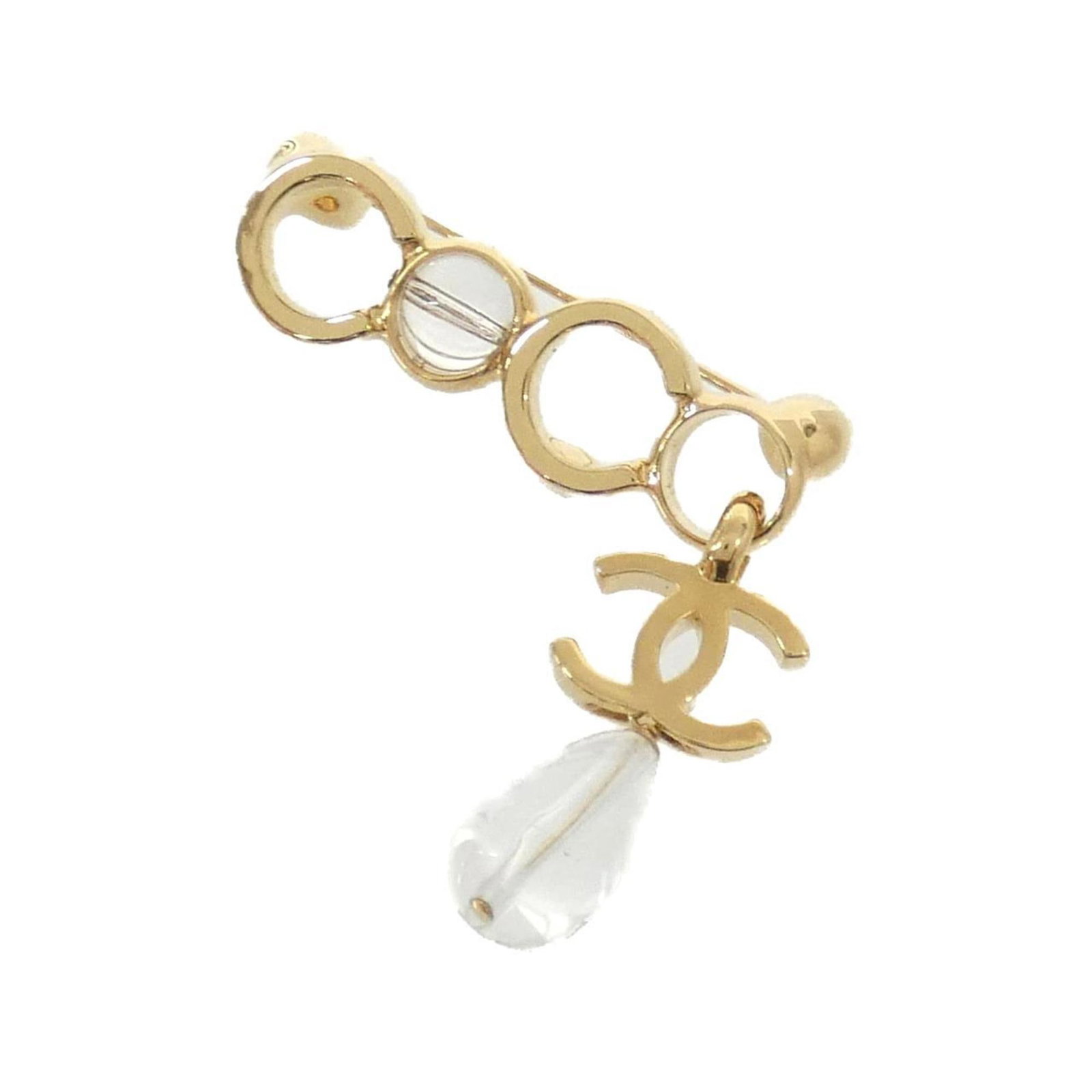 Chanel Brooch: Chanel Brooch Chanel's iconic design shines through in this clear brooch, featuring the brand's signature style. Measuring 4.2cm x 4.5cm, it bears a few traces of usage, including some scratches and