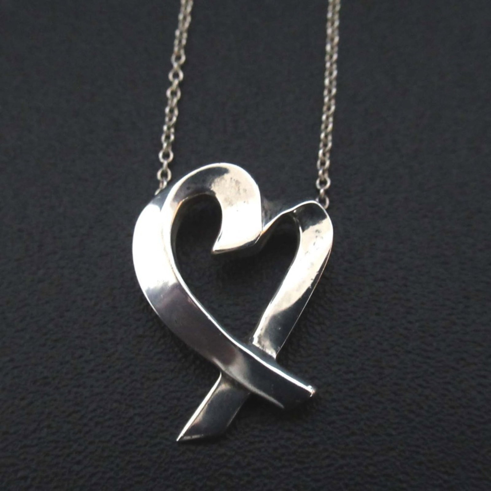 Tiffany & Co. Paloma Picasso Loving Heart Necklace Pendant In 925 Sterling Silver For Women: Tiffany & Co. Paloma Picasso Loving Heart Necklace Pendant In 925 Sterling Silver For Women Tiffany & Co.'s Paloma Picasso Loving Heart Necklace Pendant shines in sterling silver, its delicate design 