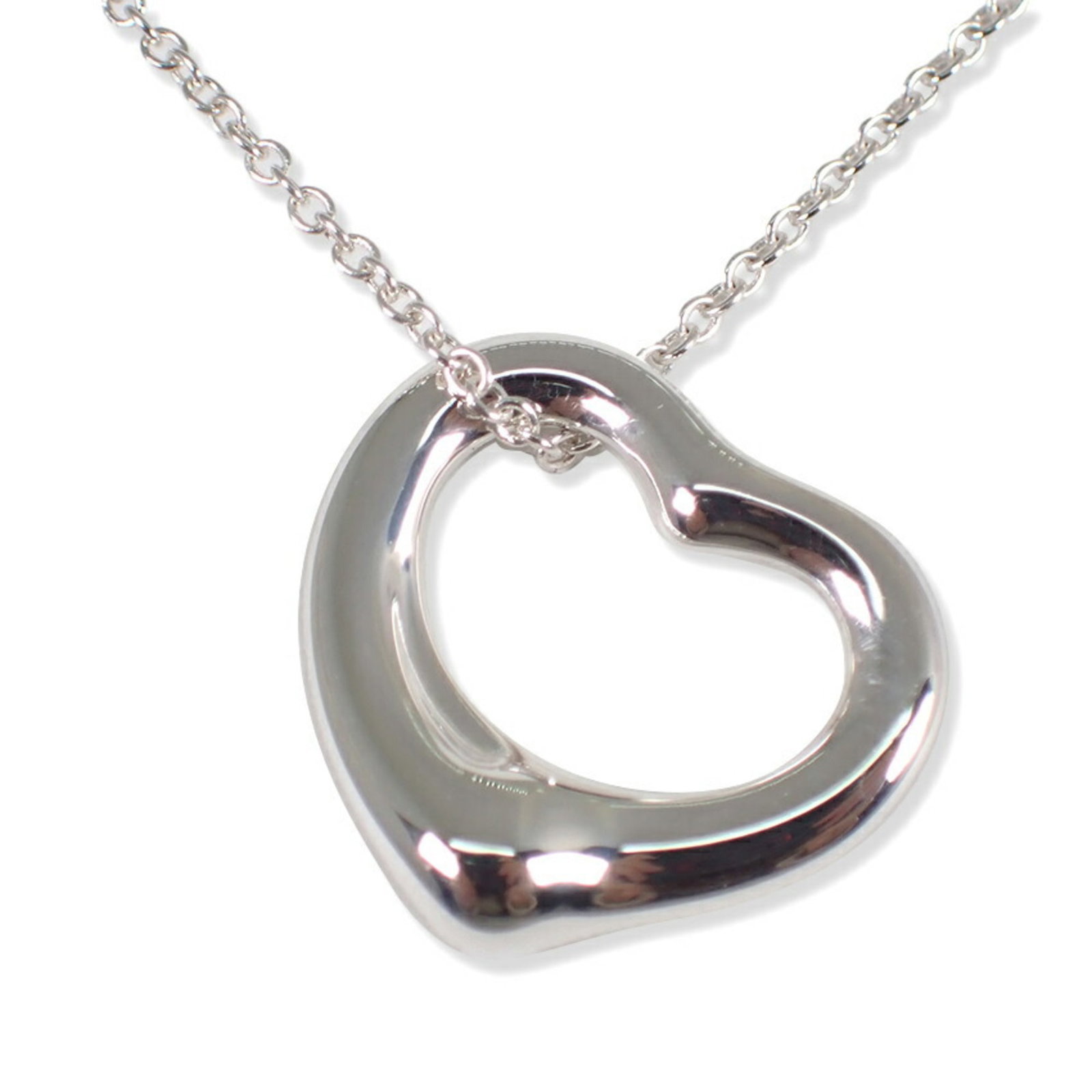 Tiffany & Co. 925 Heart Pendant Necklace: Tiffany & Co. 925 Heart Pendant Necklace Sterling silver pendant necklace from Tiffany & Co., featuring a heart-shaped design with a silver finish. The necklace measures 41 cm in circumference and