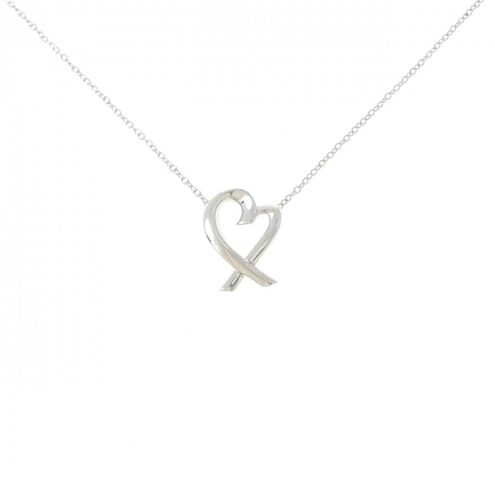 Small Loving Heart Necklace by Tiffany: Small Loving Heart Necklace by Tiffany Small Loving Heart Necklace by Tiffany features a sterling silver pendant with a 14.7mm x 11.7mm heart shape, set in a necklace designed for women. The piece