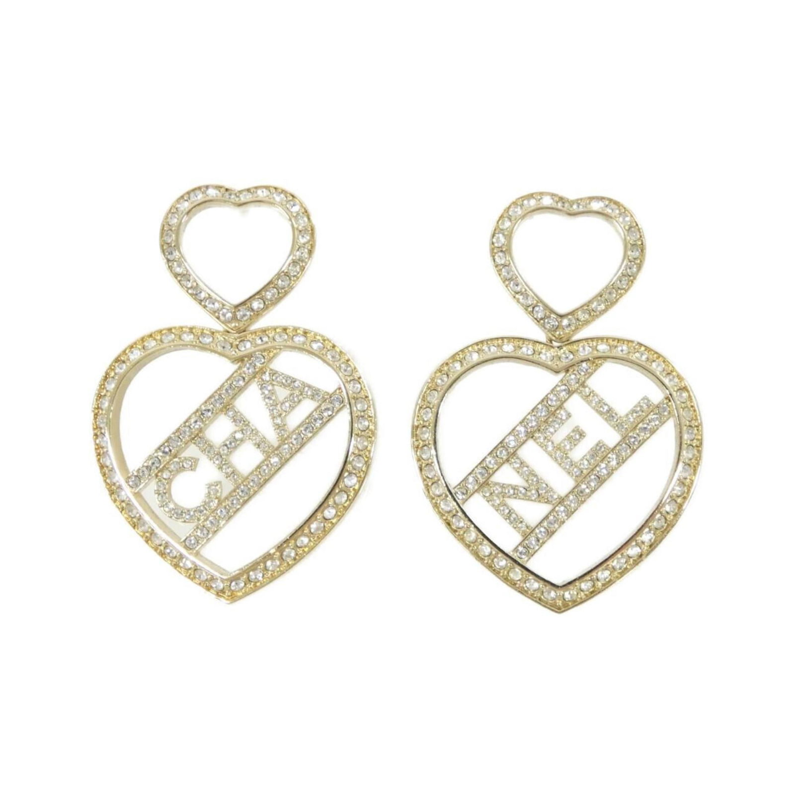 Chanel Stud Earrings: Chanel Stud Earrings Stud earrings in gold, bearing the iconic Chanel design. Made from a durable material, these earrings have been worn and show some signs of usage, including minor scratches and